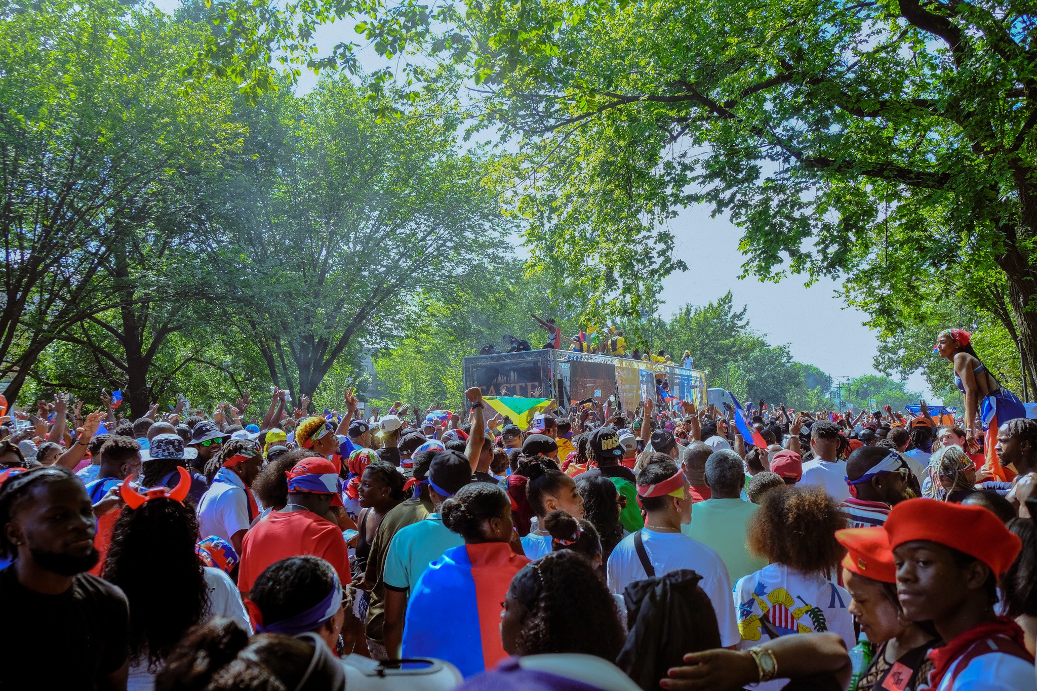 As the Haitian float made its way down, hundreds of Haitians and other participants gathered.