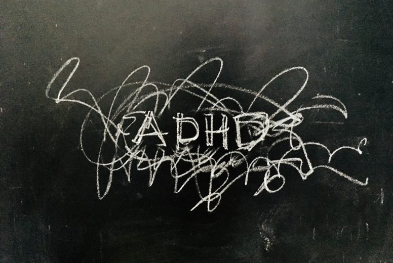 ADHD written on a blackboard - Bridge The Gap