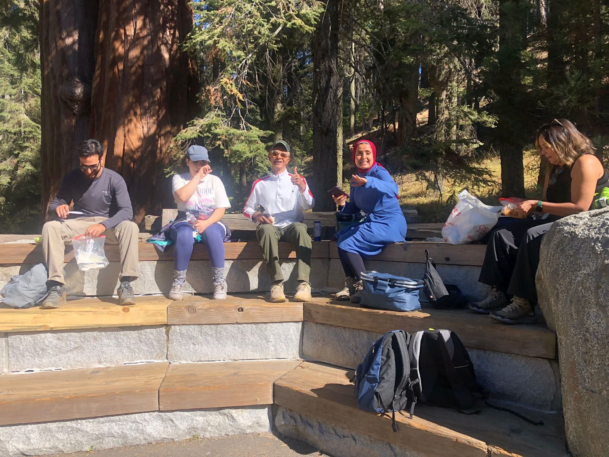 Hikers Enjoying a Snack Break in Sequoia National Park Amid Towering Trees - Sequoia Trip.jpeg