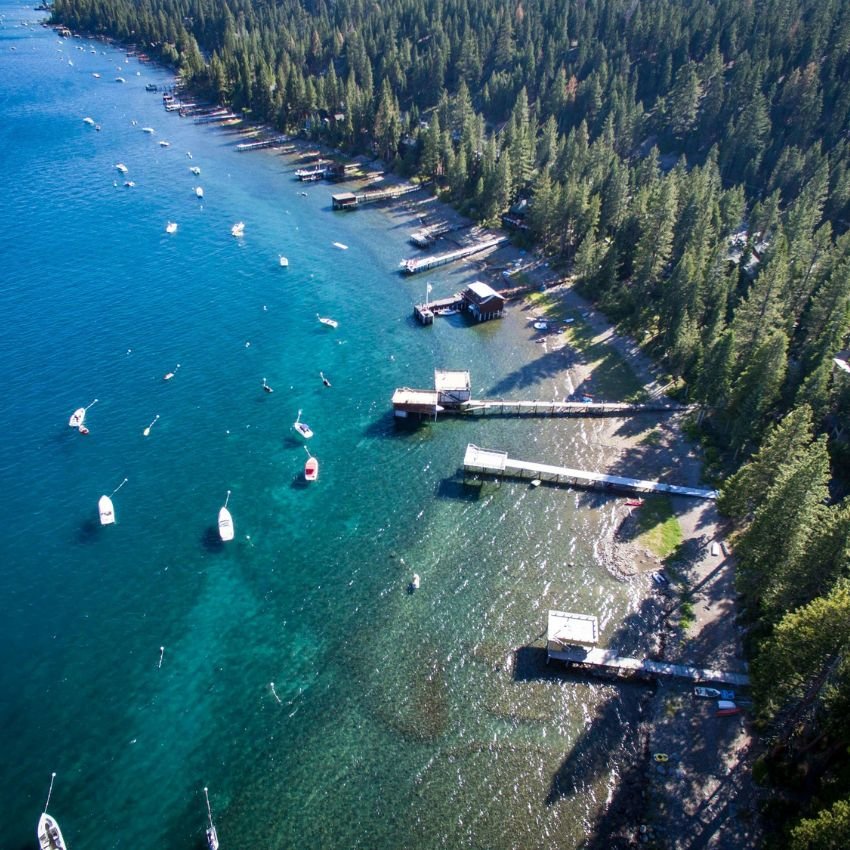 Aerial View of Lake Tahoe Docks and Boats Along a Pine Forest Shoreline.jpg