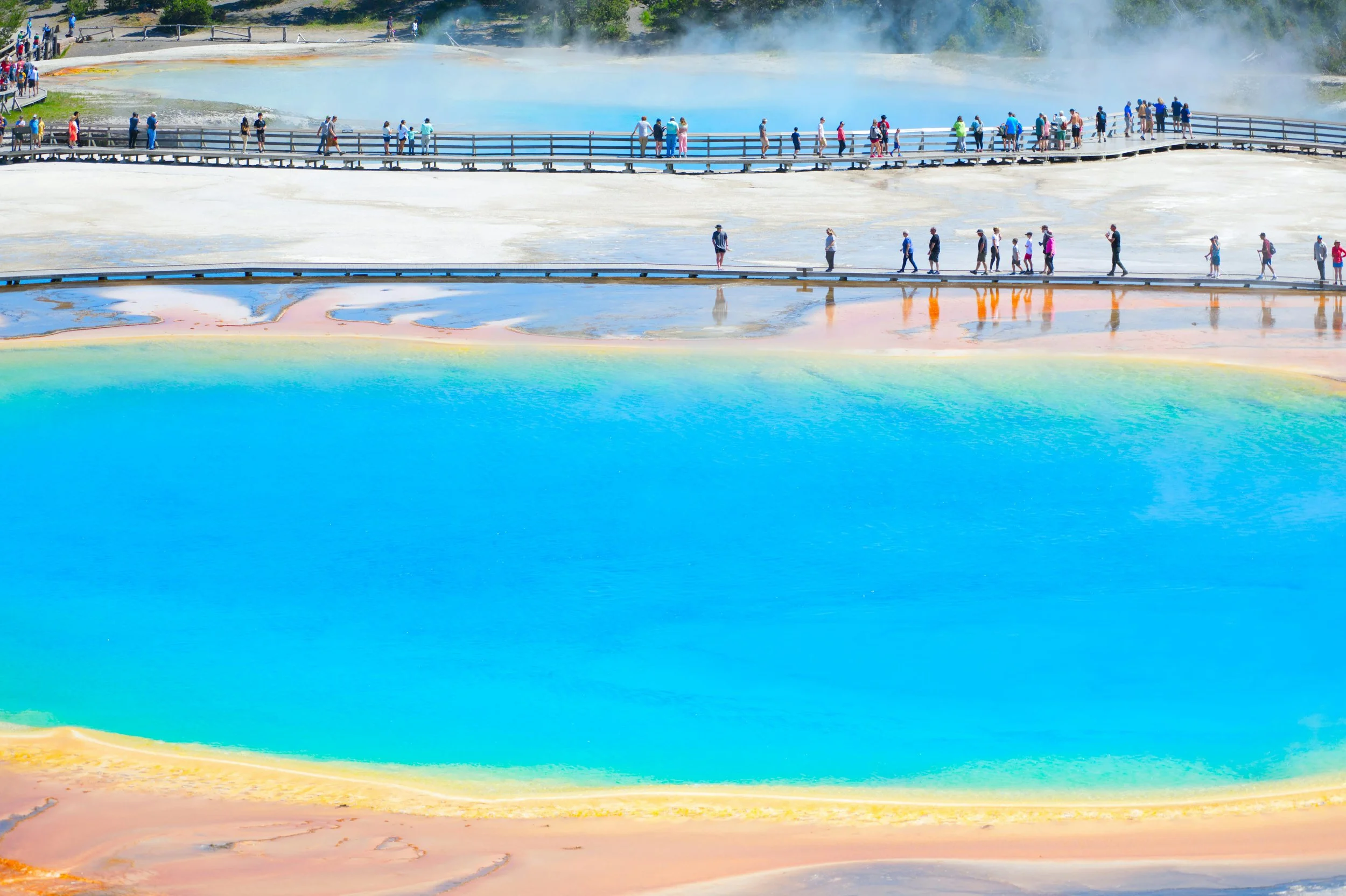 Mammoth Hot Springs: "Breathtaking view of Mammoth Hot Springs, showcasing the unique travertine terraces in vibrant colors.