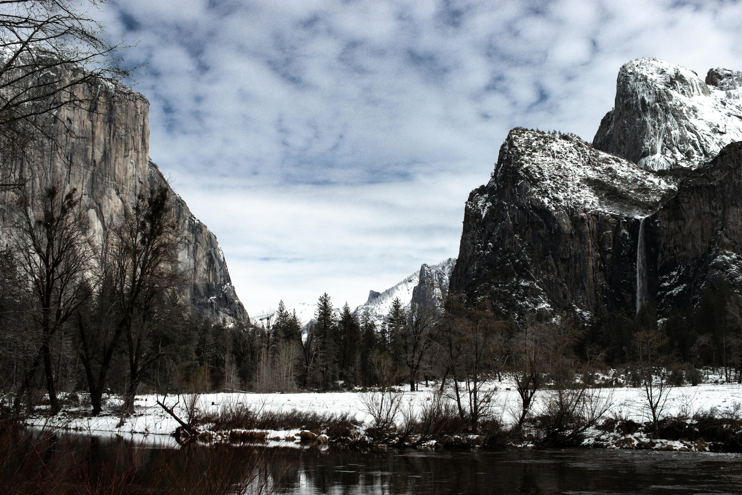 Mirror Lake Reflection: "Mirror Lake reflecting the surrounding granite cliffs and pine trees, creating a serene and picturesque scene