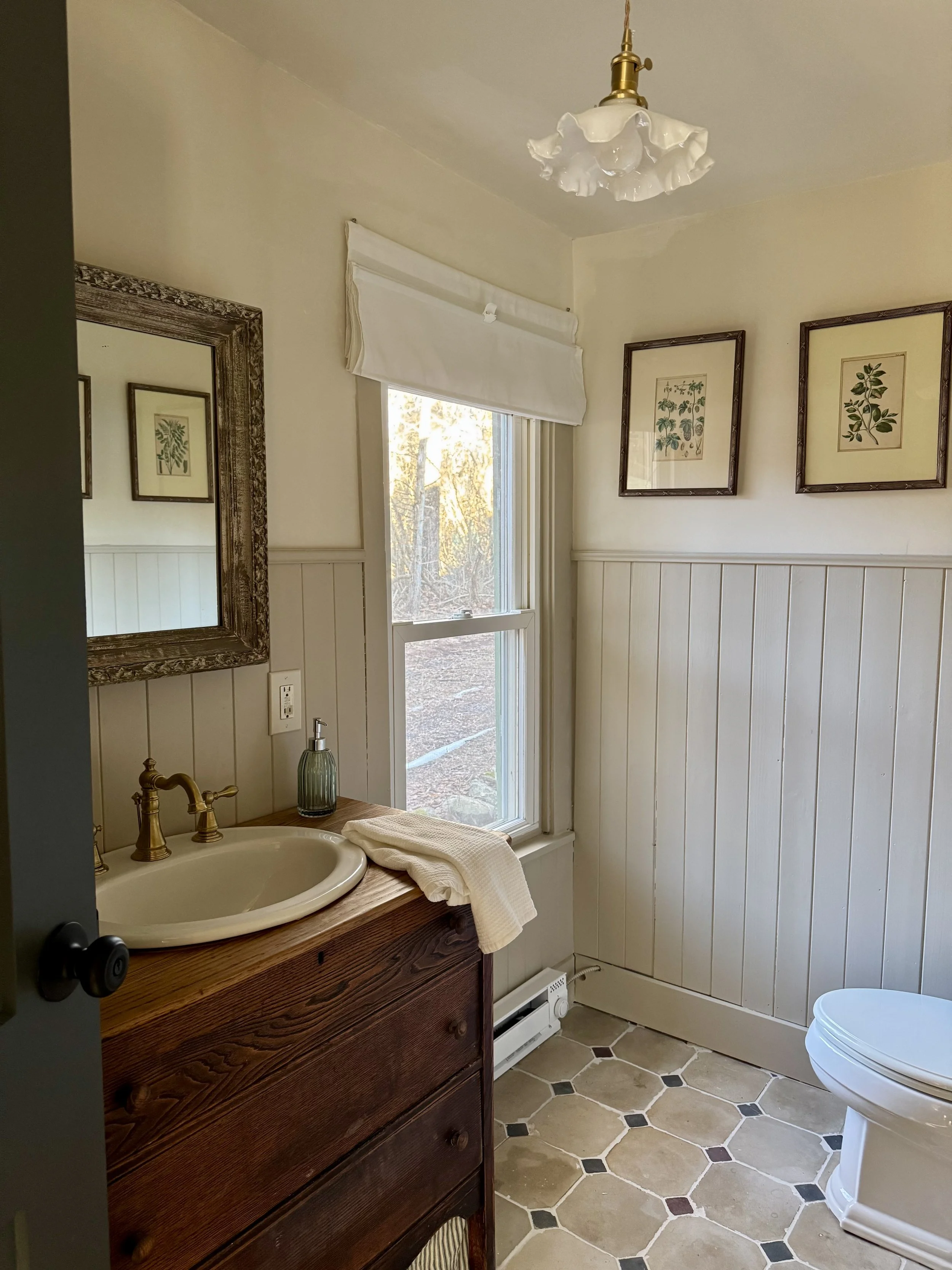 Finished downstairs bathroom with salvaged antique French tiles
