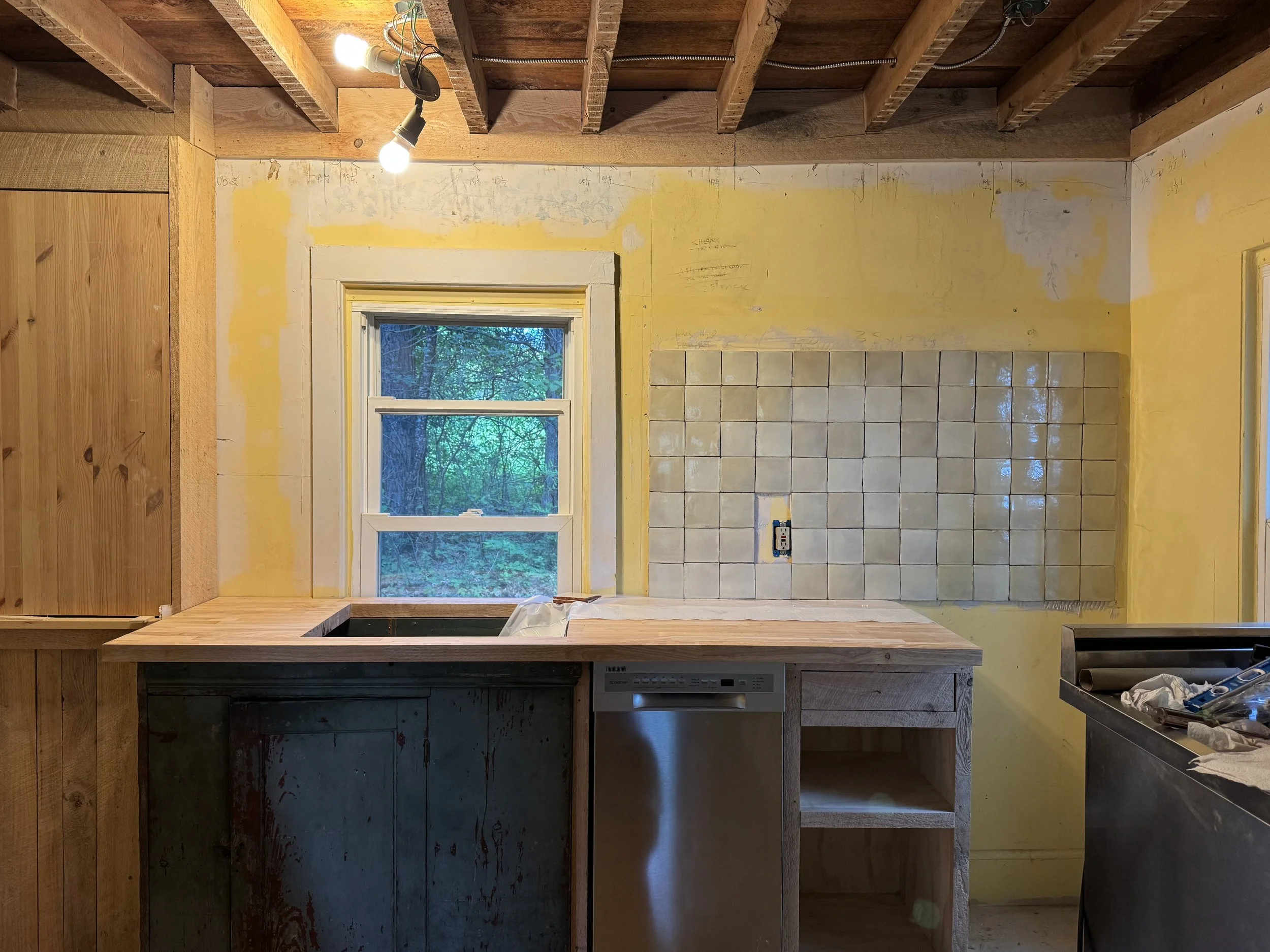 Reworking the kitchen with vintage tiles and an antique cupboard