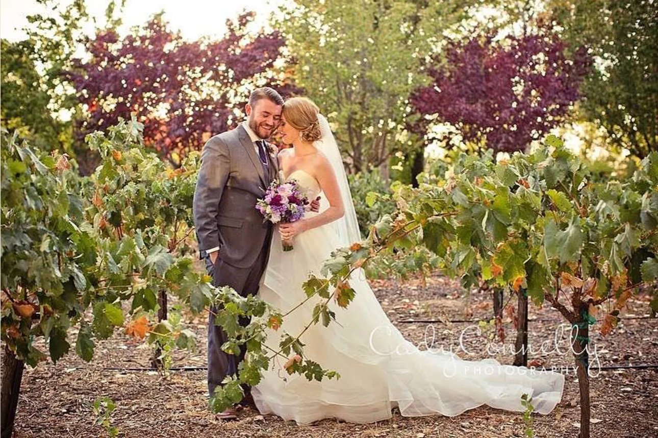 Bride and groom in vineyard - Four Sisters Ranch - Paso Robles wine country wedding