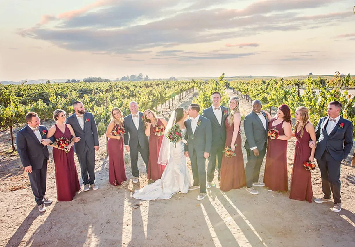 Bridal party in vineyard at Four Sisters Ranch winery wedding venue in Paso Robles, California.