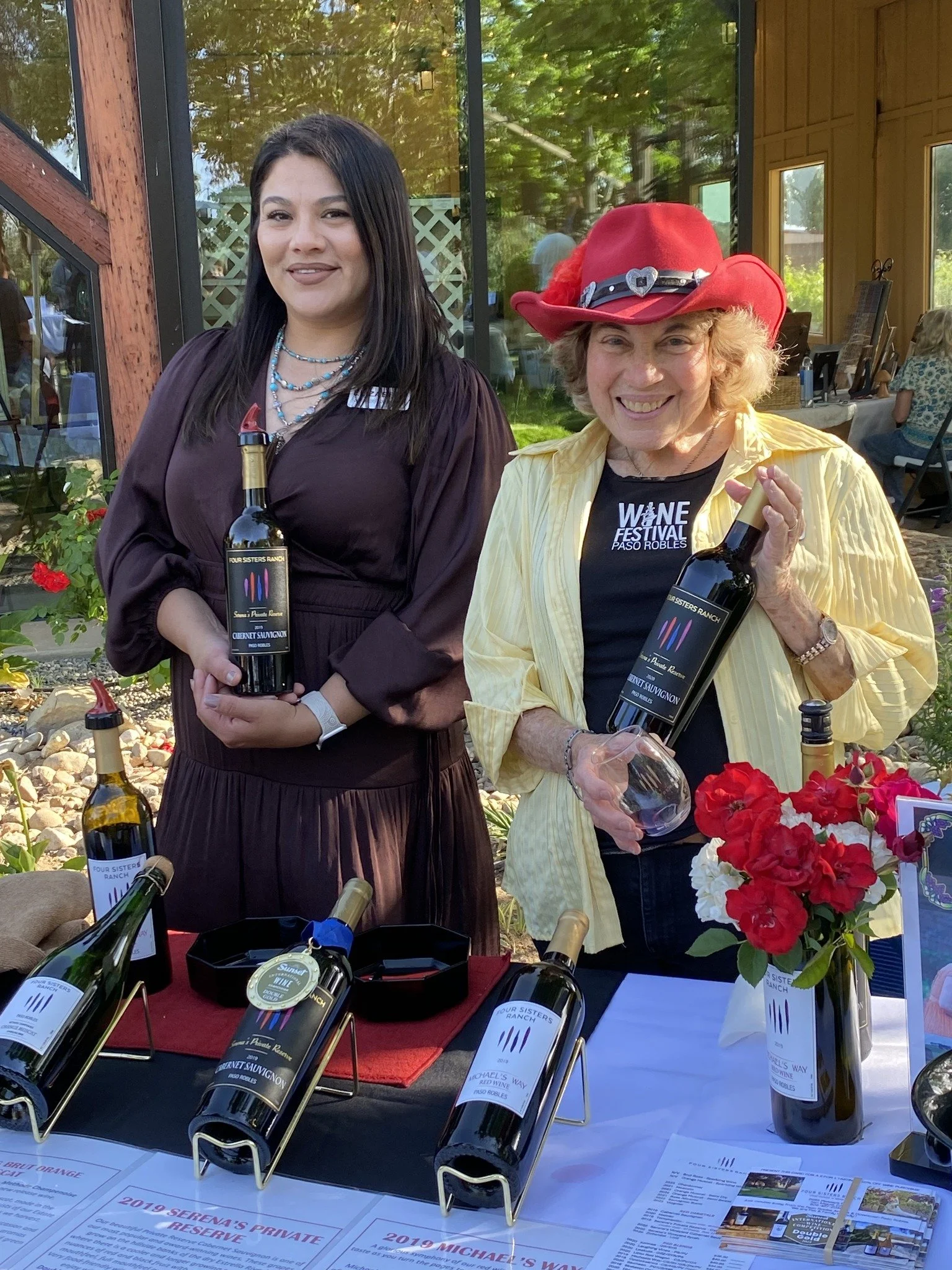 Elizabeth and Serena pouring wine at Four Sisters Ranch during Twilight Tasting with the Pleasant Valley Wine Trail in Paso Robles wine country