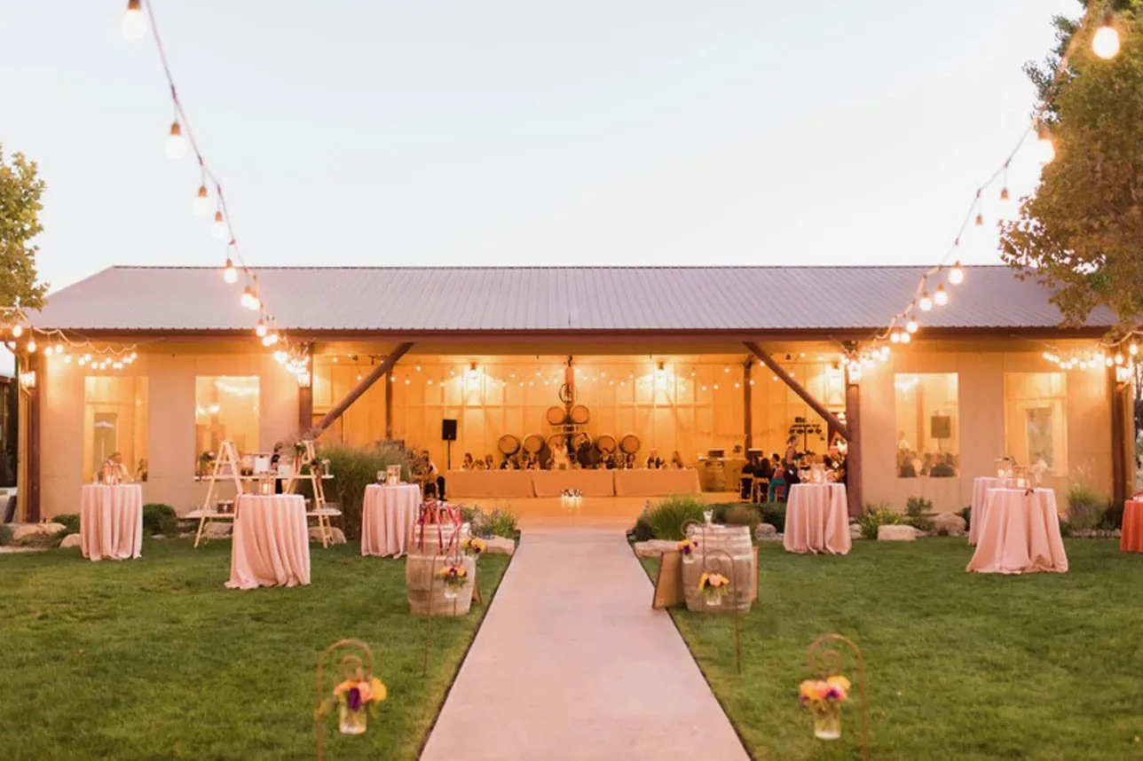 Wedding reception at twilight under the bistro lights at Four Sisters Ranch Vineyards & Winery - Paso Robles wine country