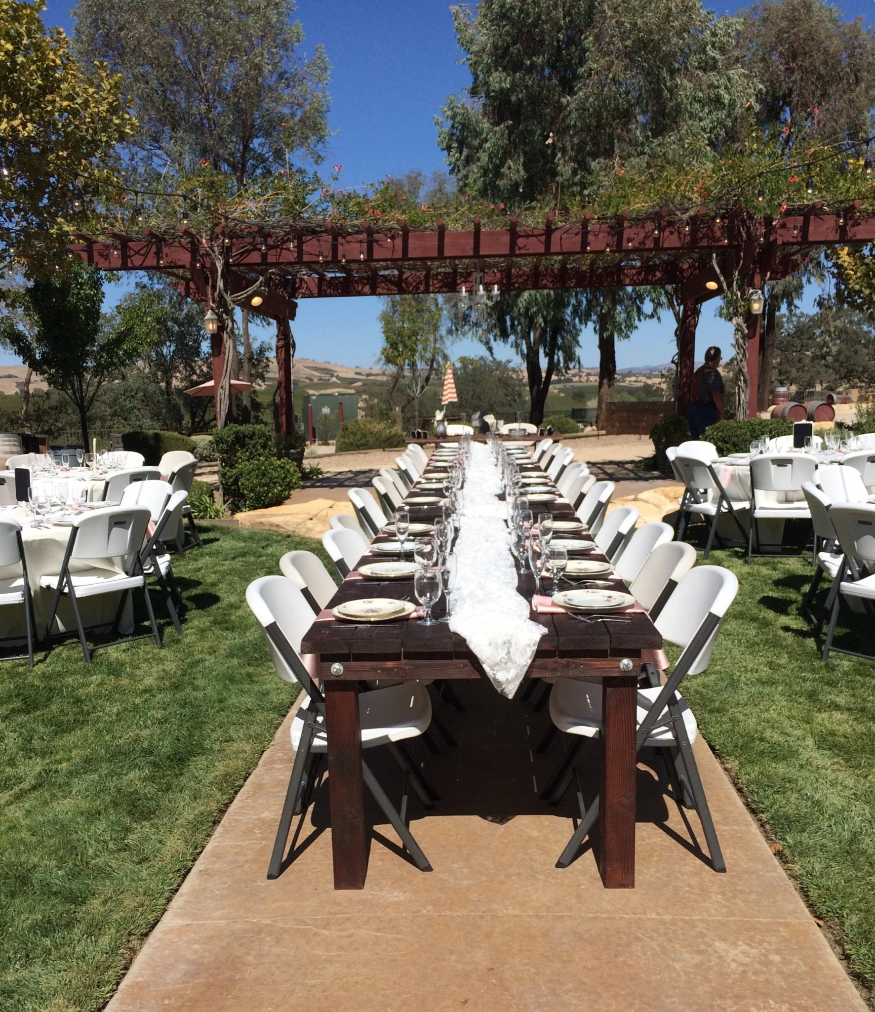 Outdoor wedding reception with vineyard views at Four Sisters Ranch Vineyard & Winery wedding venue in Paso Robles wine country