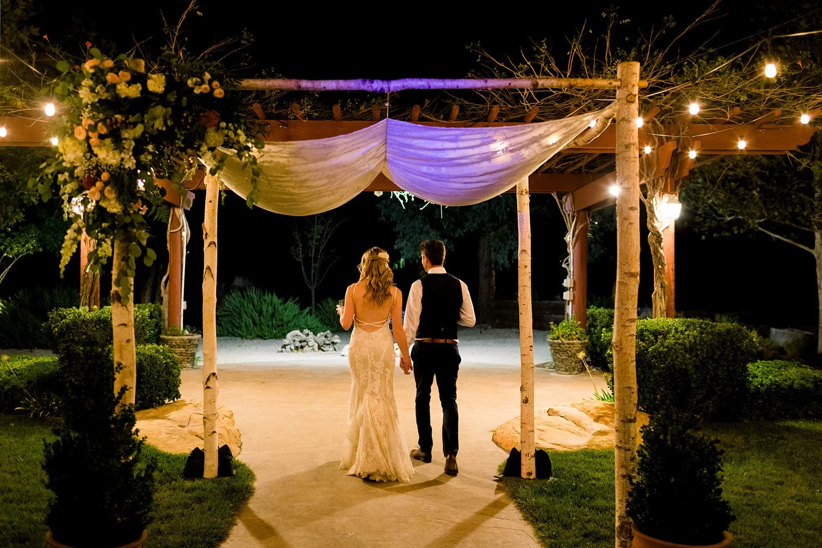 Bride and groom under the chuppah at Four Sisters Ranch Winery & Vineyards wedding venue in Paso Robles wine country