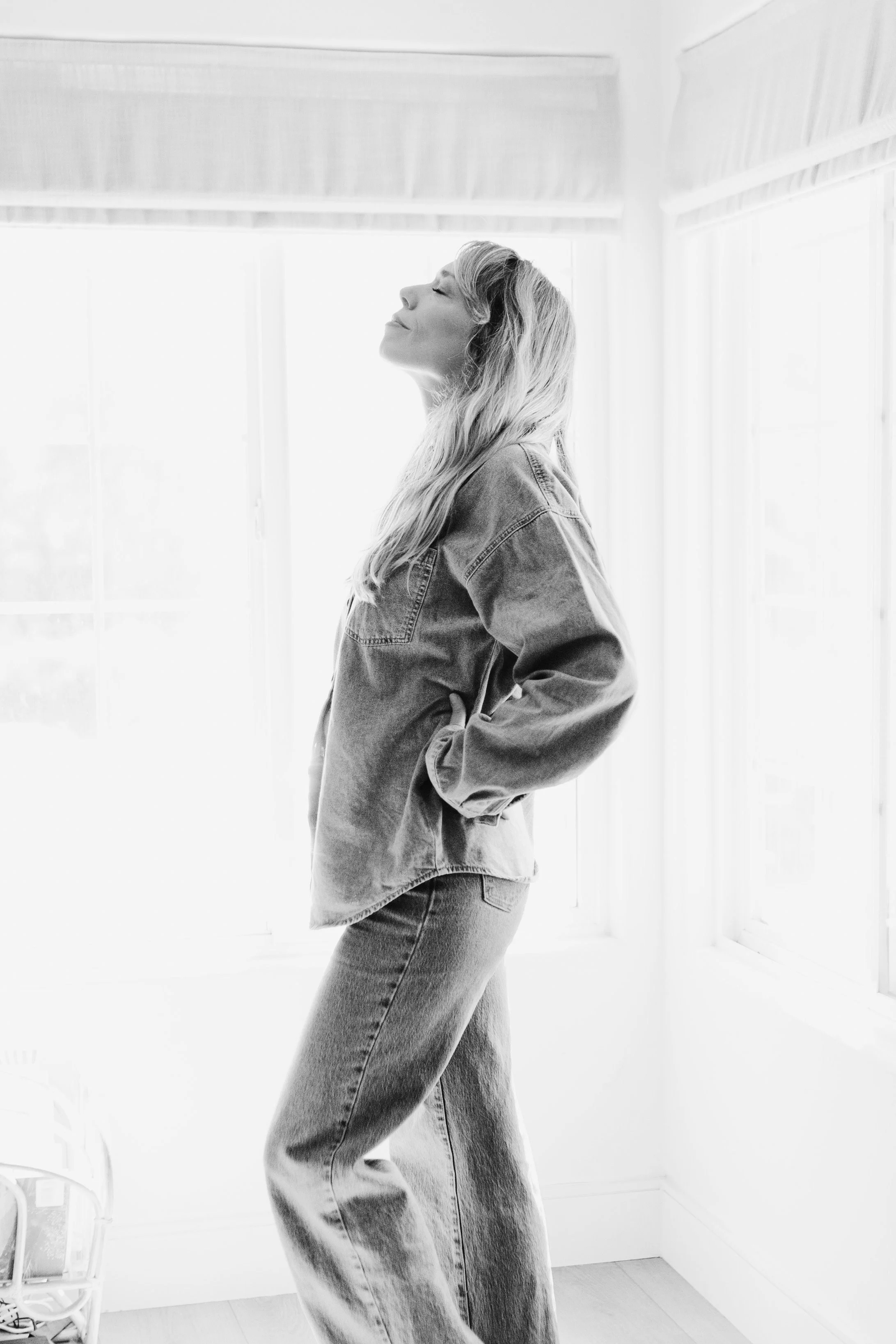 Learning to stay with what is here, Heidi breathes deep by the window