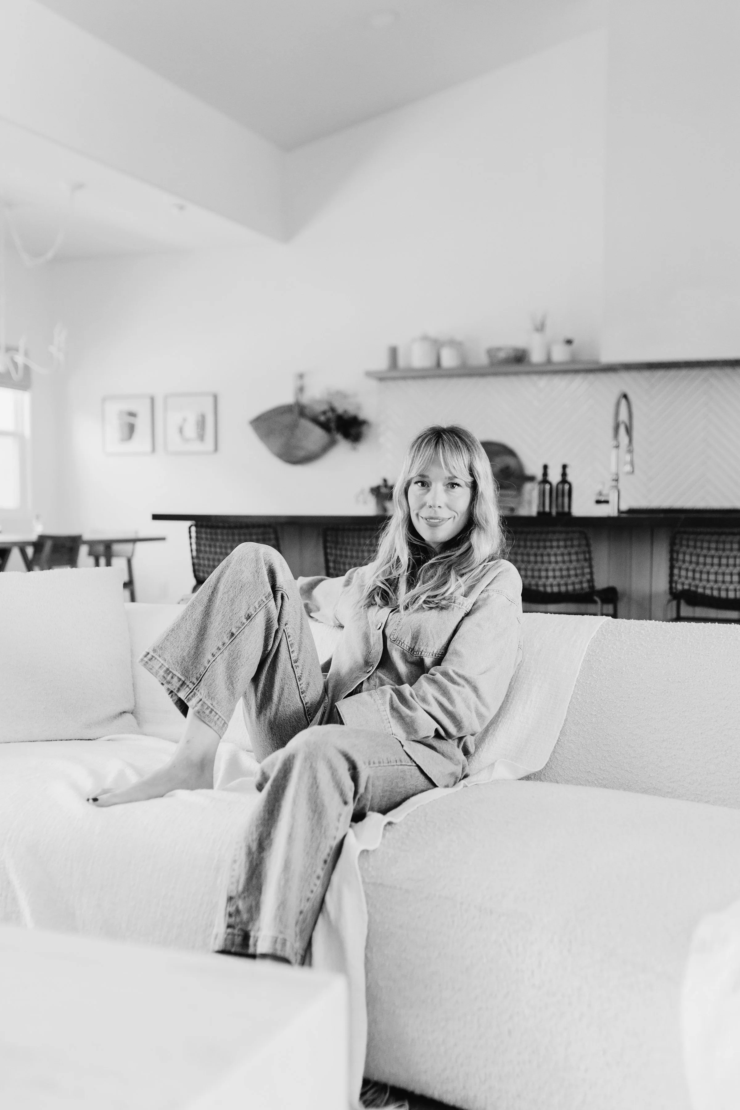 Sharing my story, Heidi sits on the sofa