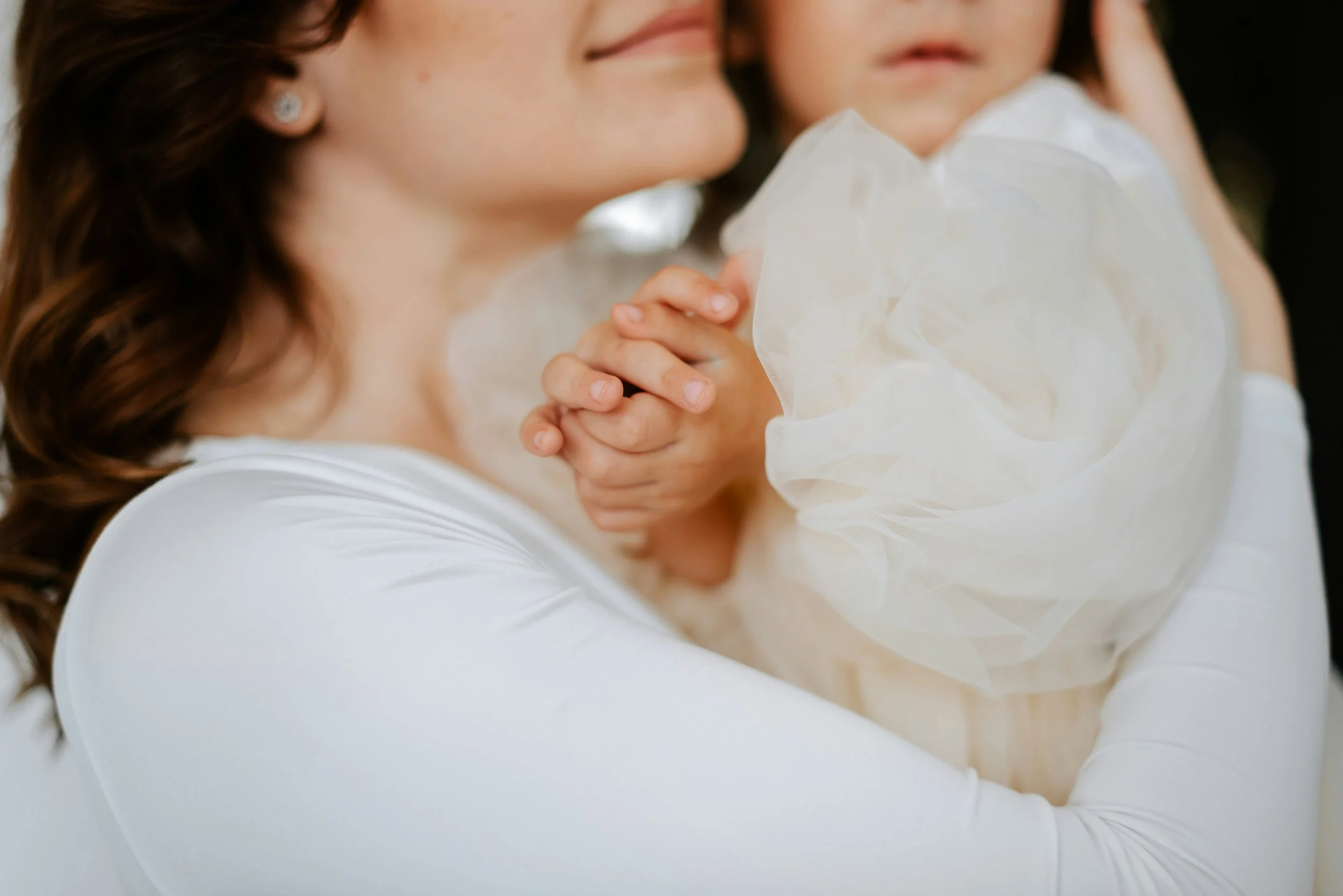 Mother holding a young child close, symbolizing warmth, support, and the journey to natural conception and motherhood