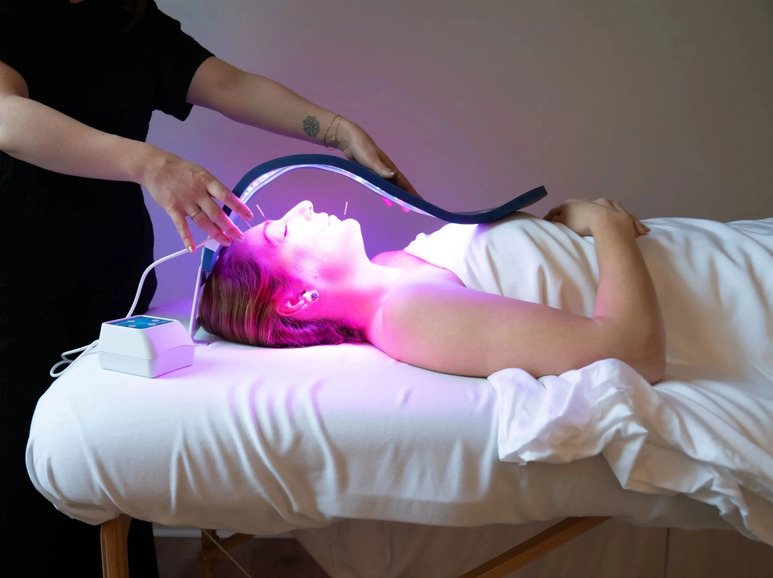 Red light therapy used during a facial acupuncture treatment at The Violette House in Groton, MA