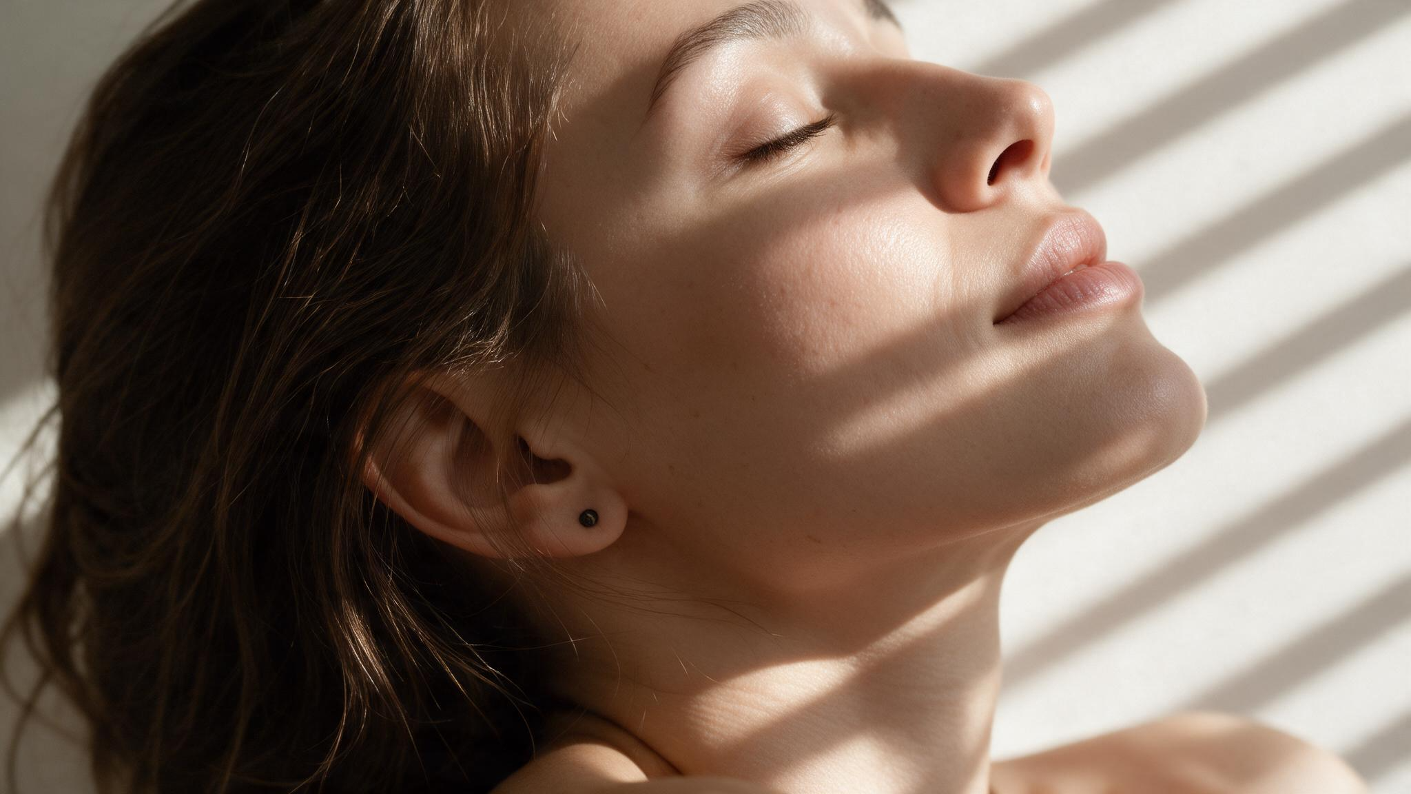 Woman with naturally luminous skin after a personalized skincare treatment
