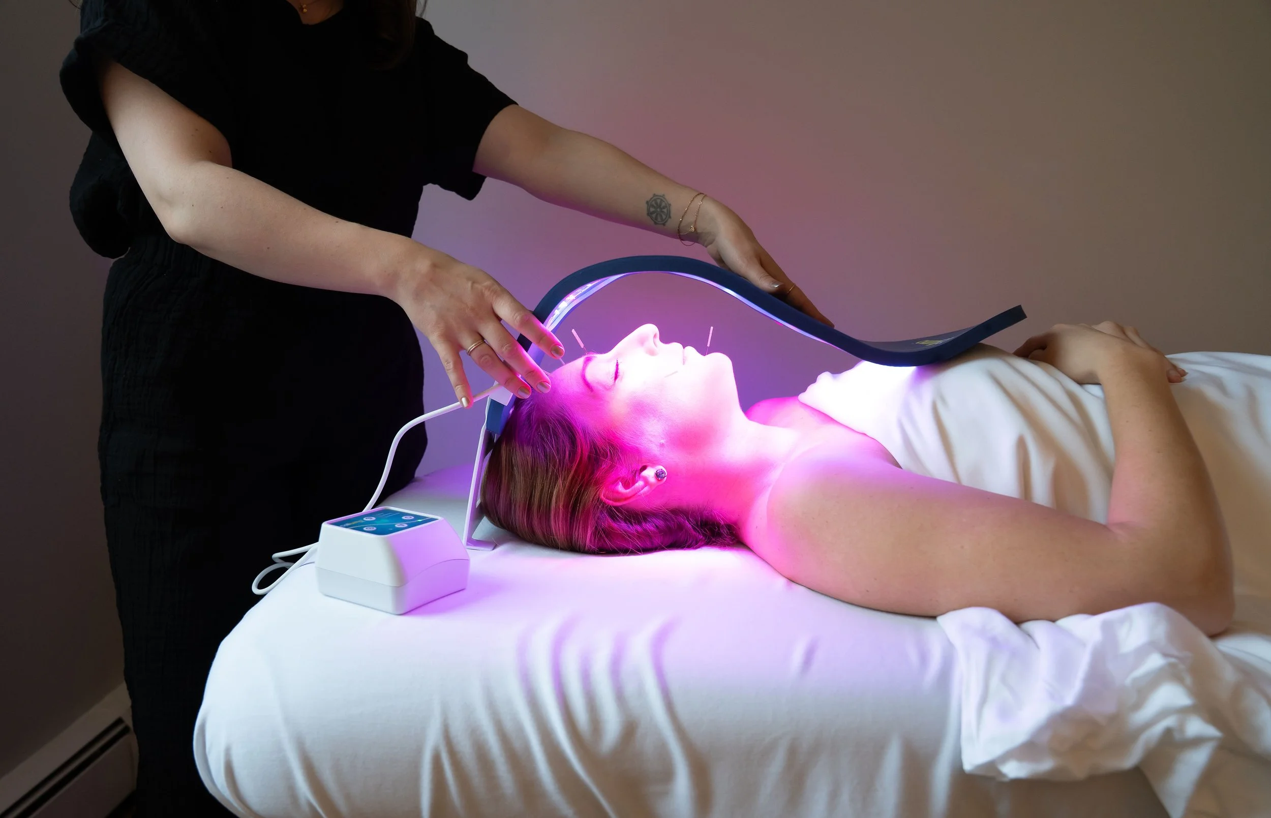 Patient receiving red light therapy alongside acupuncture at The Violette House in Groton, MA