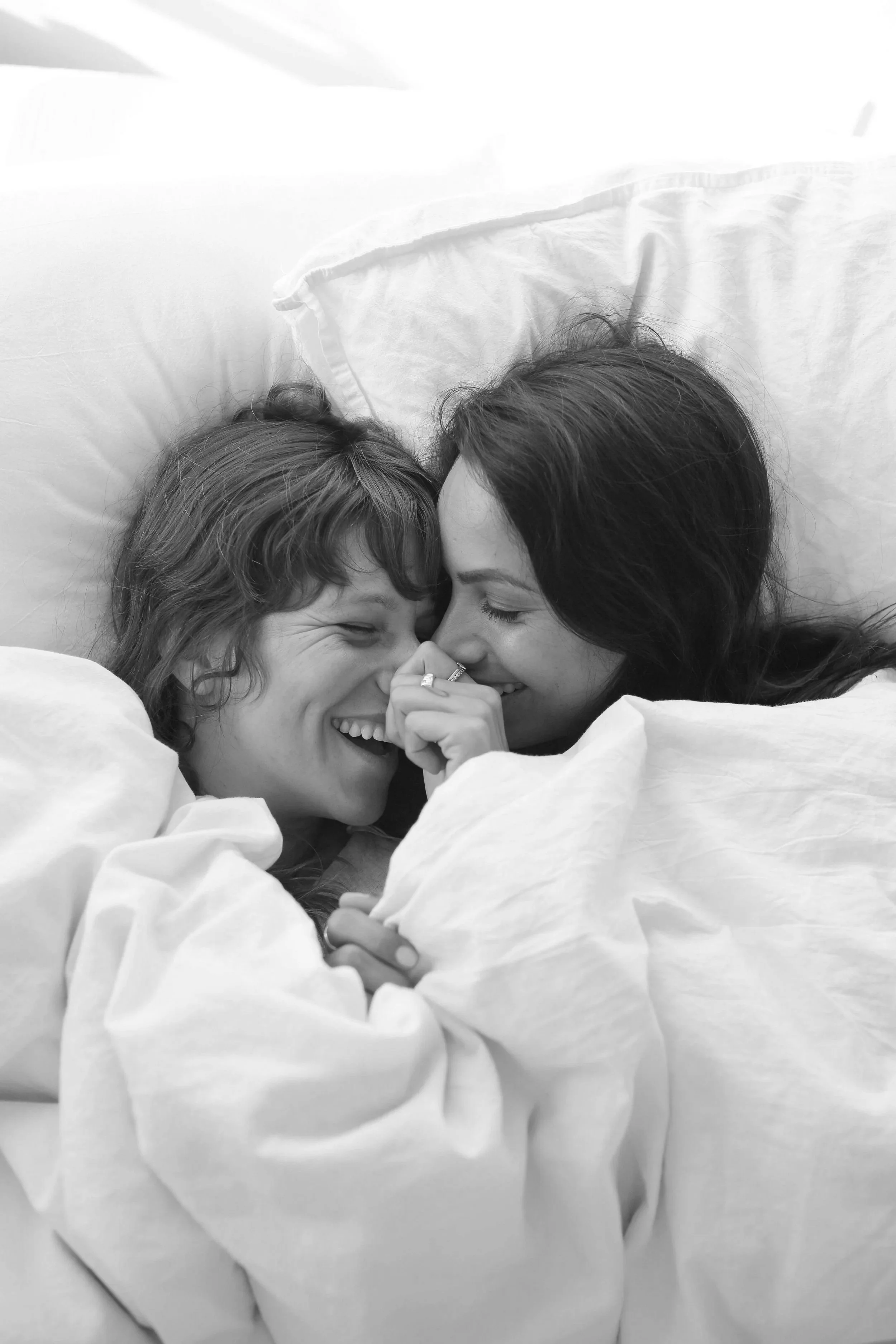 Couple sharing a close, supportive moment during their fertility journey in Groton MA