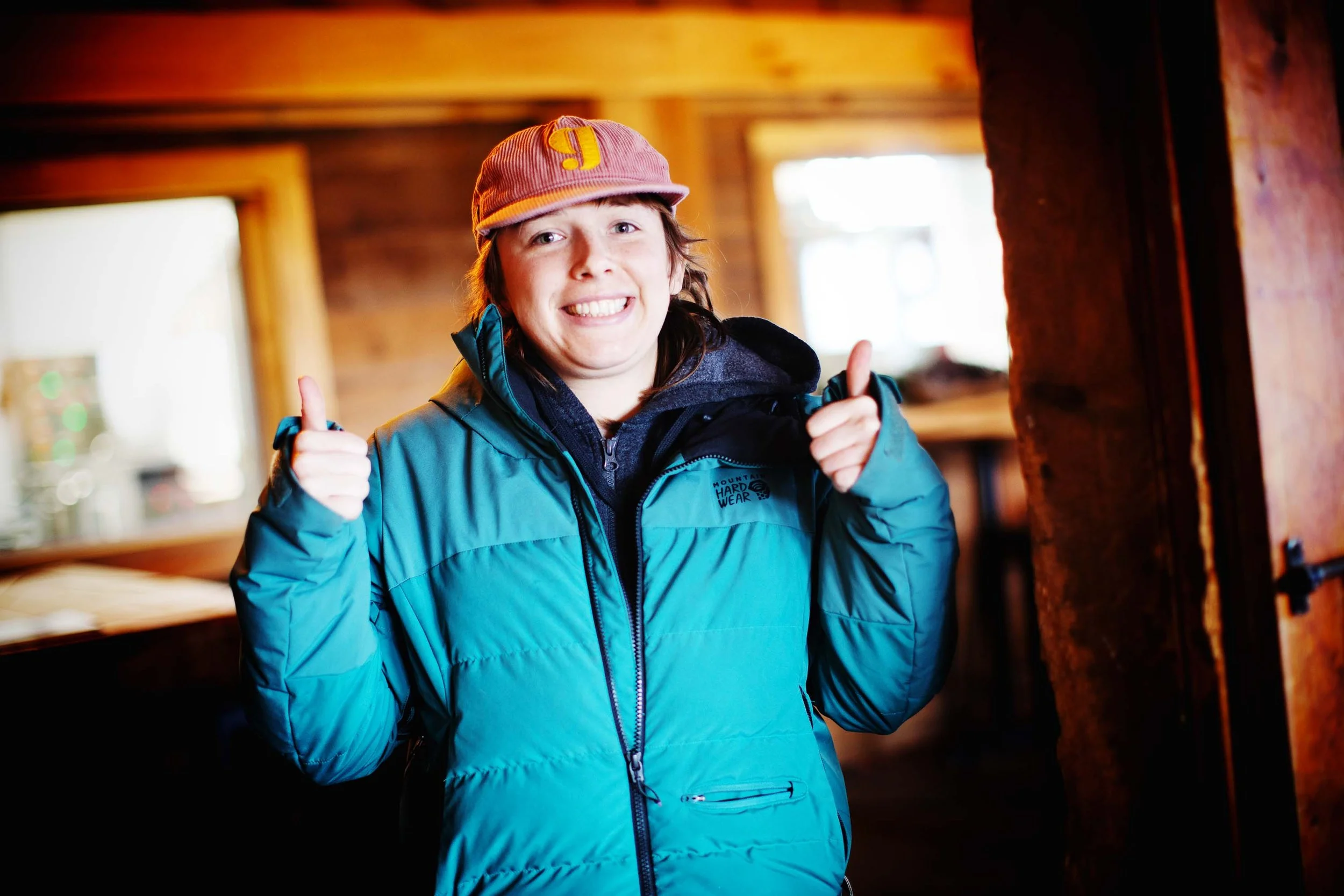Behind-the-scenes photo of star crew member - smiling on the set of That’s Not How You Christian at the Alpine Goat Brewery.