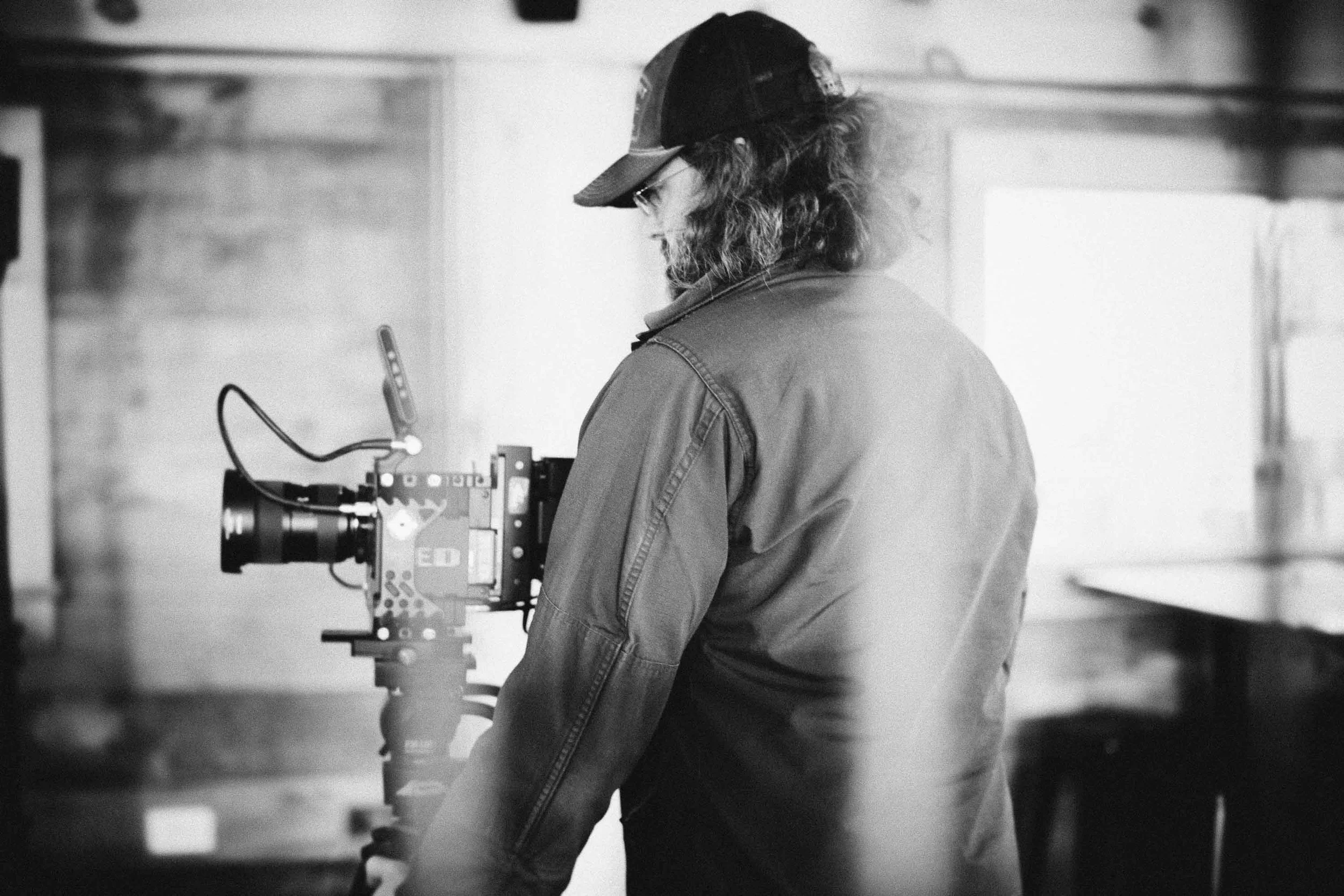 Cinematographer operating Red camera during filming of the Scotsman comedy sketches at the Alpine Goat Brewery.