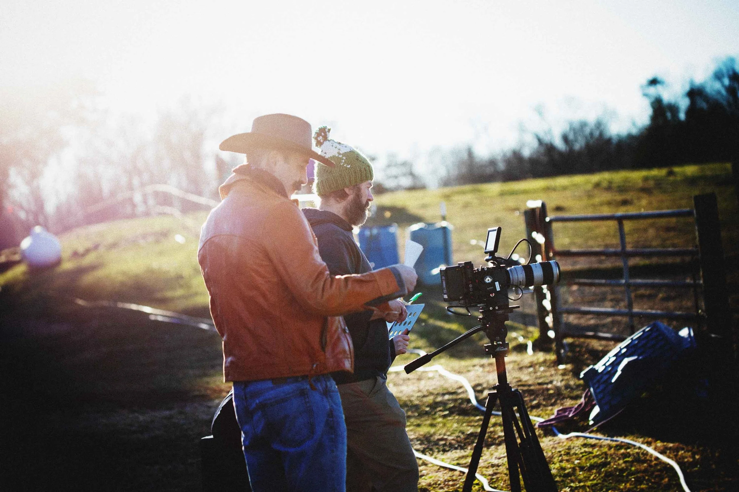 Behind the scenes photo of the writers, posing as film crew and as Samuel the Cowboy.  They are setting up an outdoor shot at the Alpine Goat Brewery in collaboration with Simply Saddle Up!