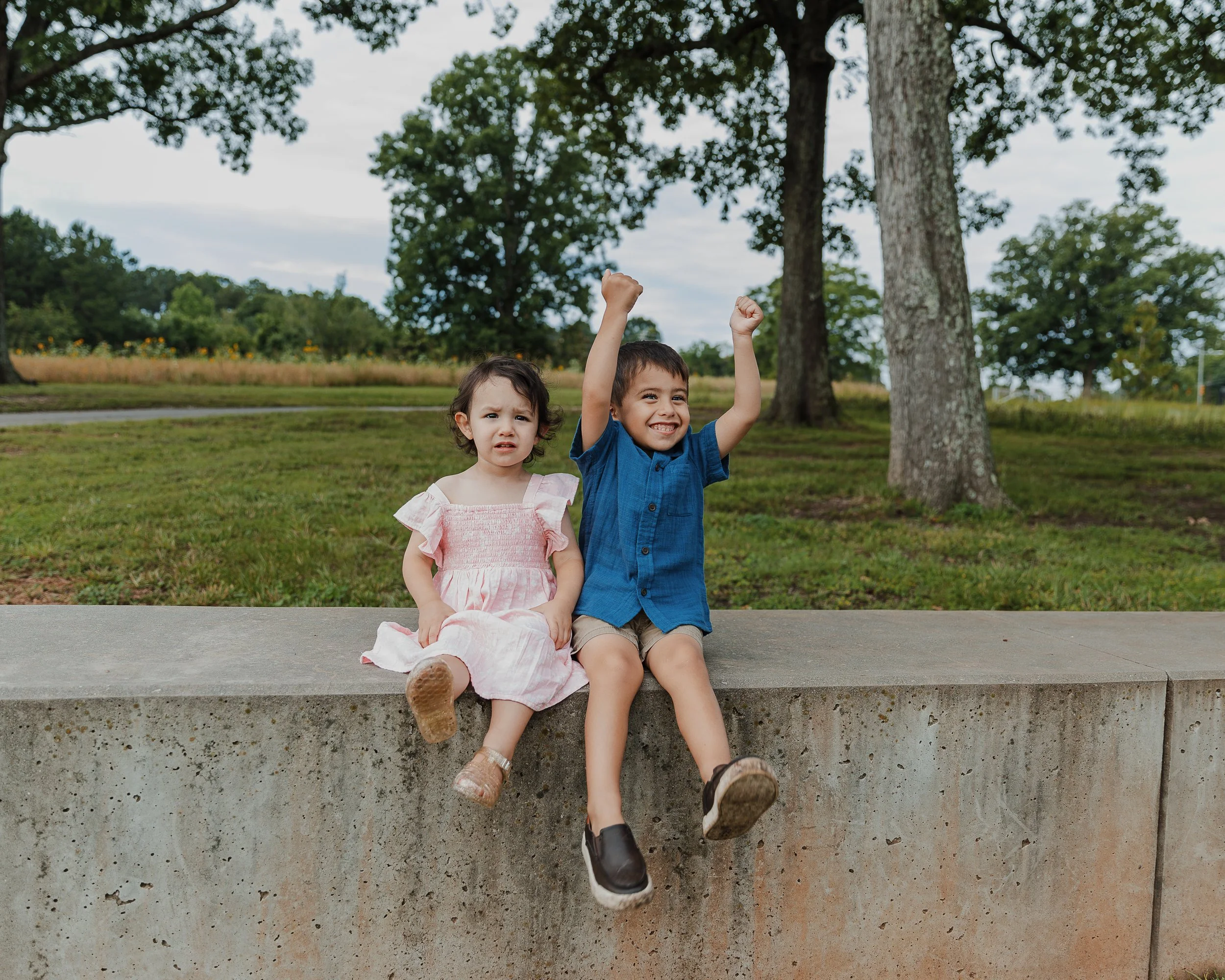 Brother and sister show off their personalities during a professional newborn session in Raleigh, NC.