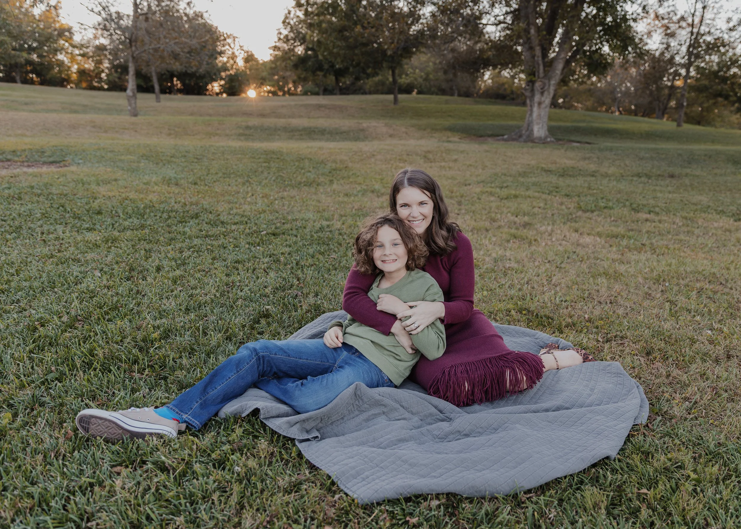Mom sits with 10-year-old son on blanket at Historic Oak View County Park during a fall family mini photo session in October 2025.
