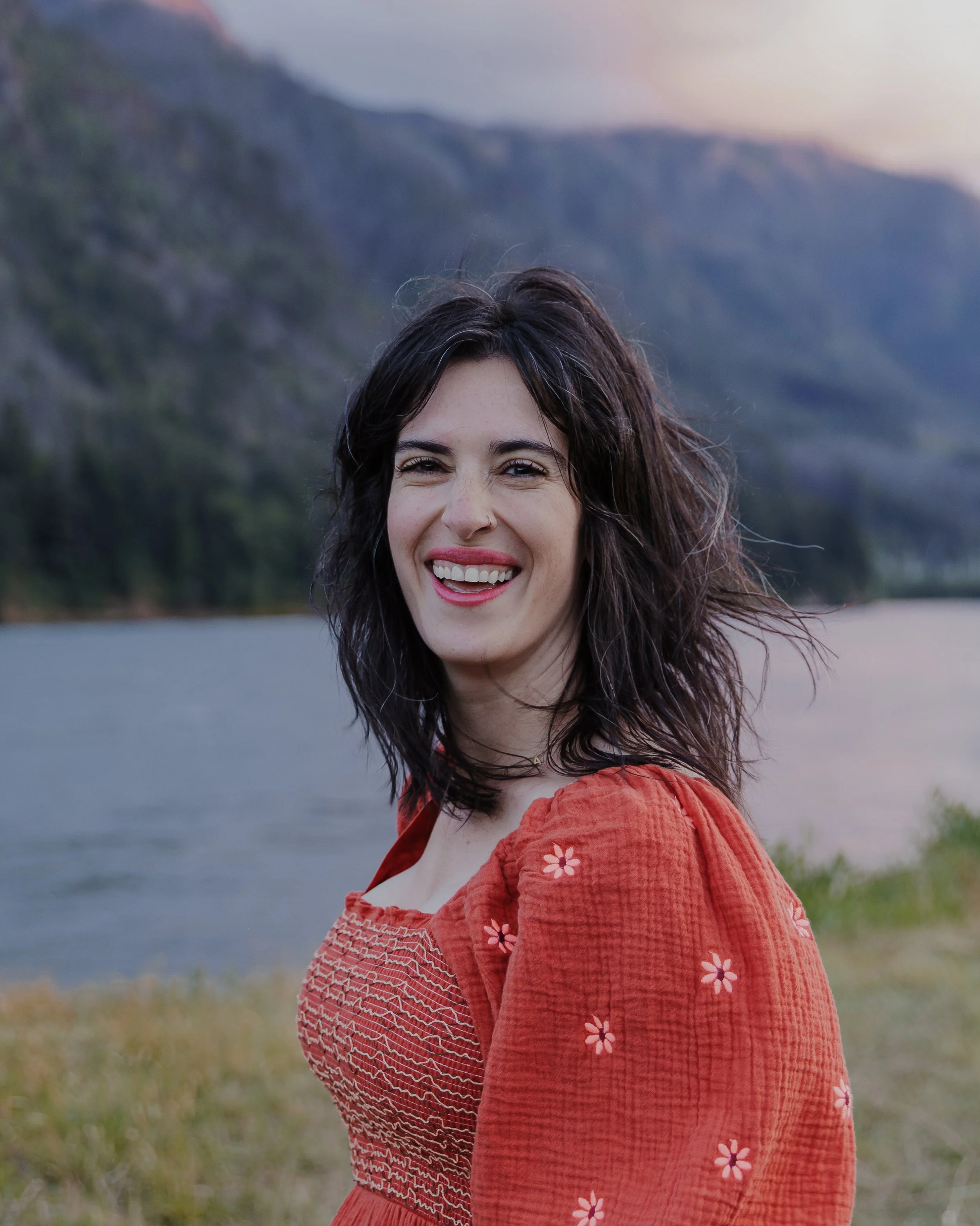 Raleigh school photographer Devin Desjarlais smiling outdoors, natural light portrait for inclusive school photography page.