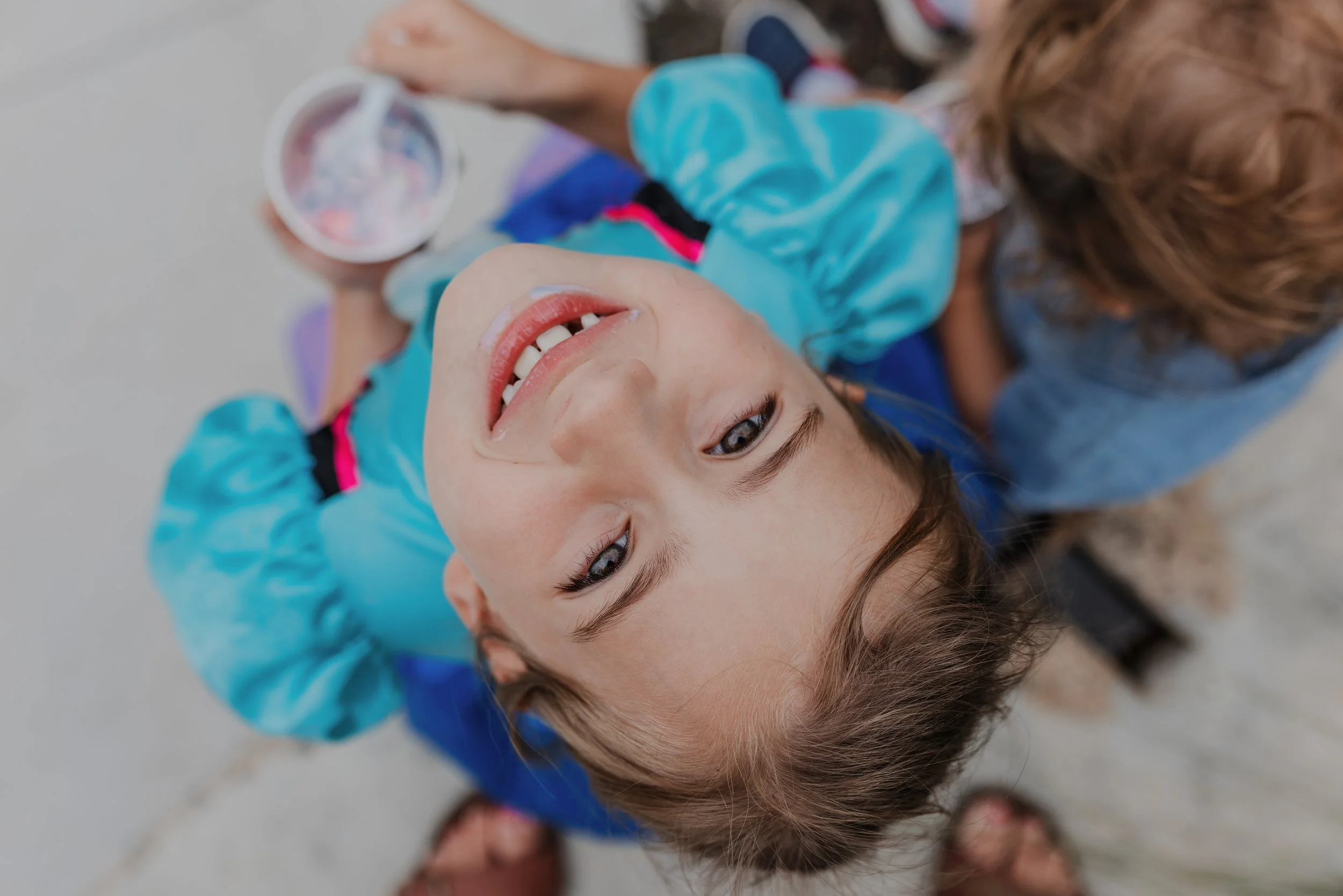 Child laughing while eating ice cream during a family outing in Raleigh NC
