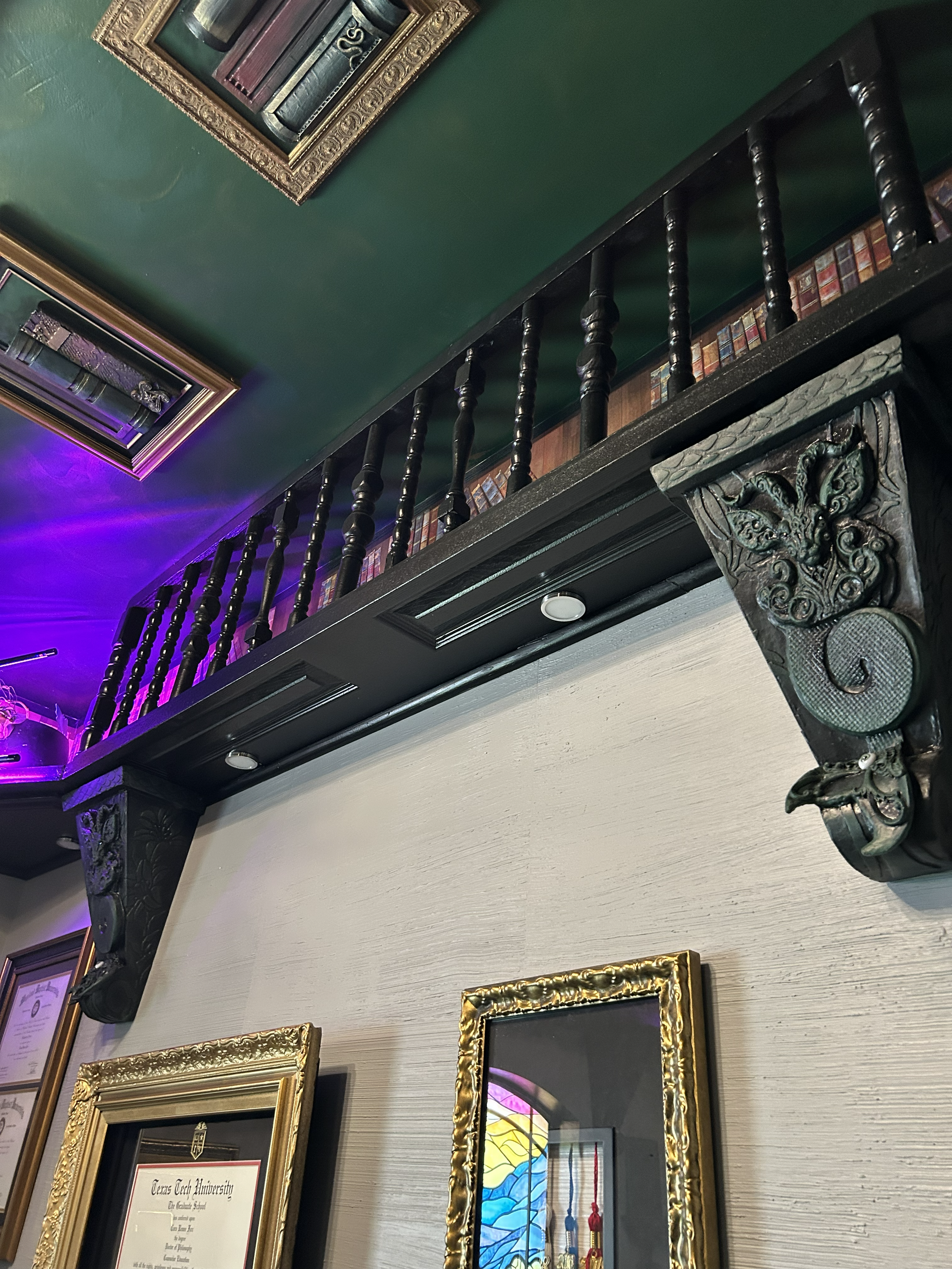 Faux Library Balcony
(per price and availability of materials. Excludes lighting and custom corbels)

estimate for 1 standard sized wall: $1000