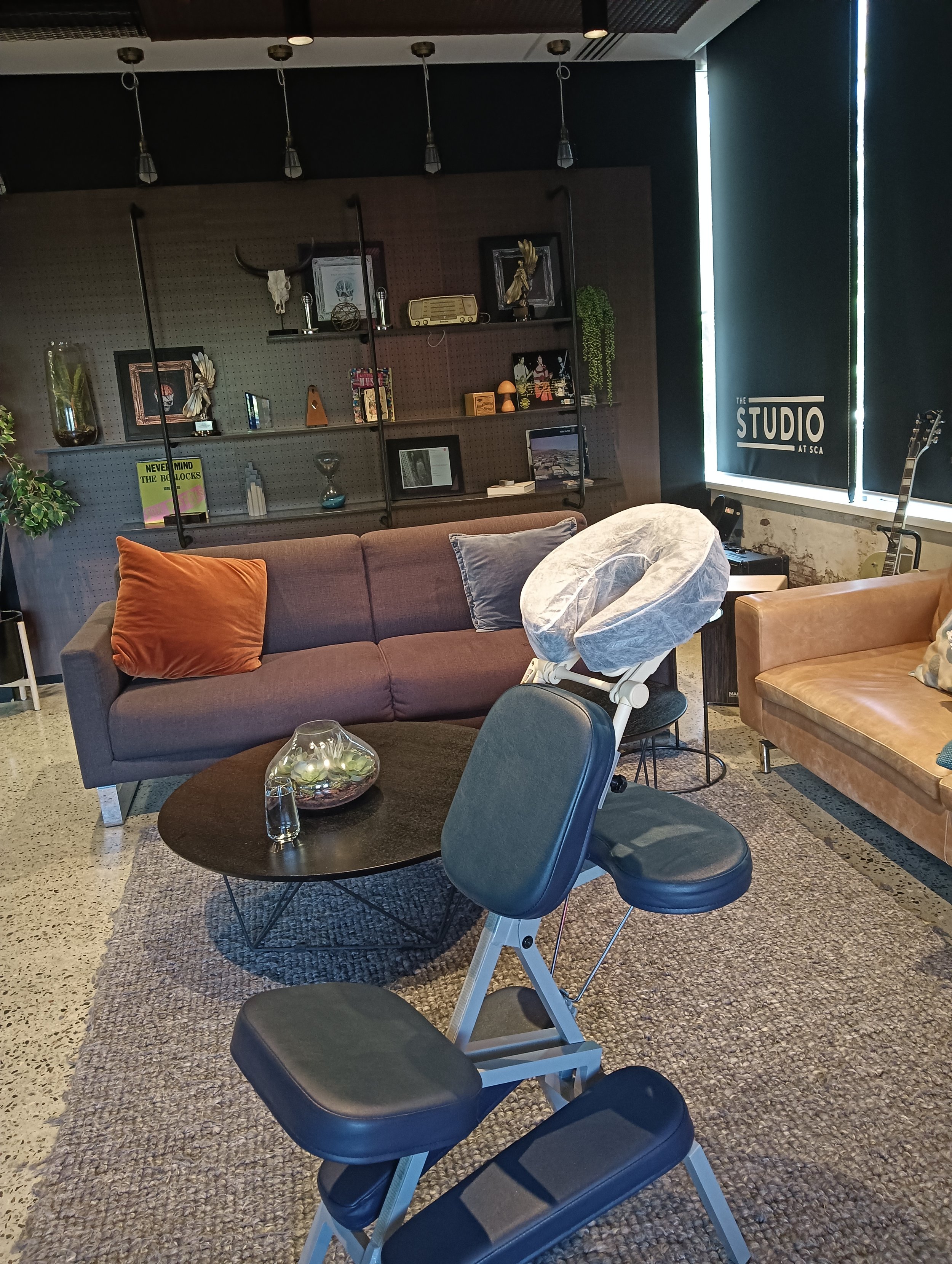 Corporate seated chair massage in a modern office supporting employee wellbeing and productivity in Perth