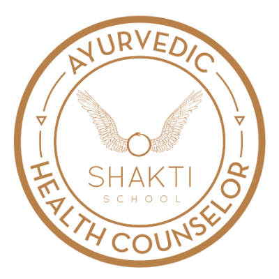 Logo of Shakti School with wings and a ring, surrounded by the words Ayurvedic Health Counselor.