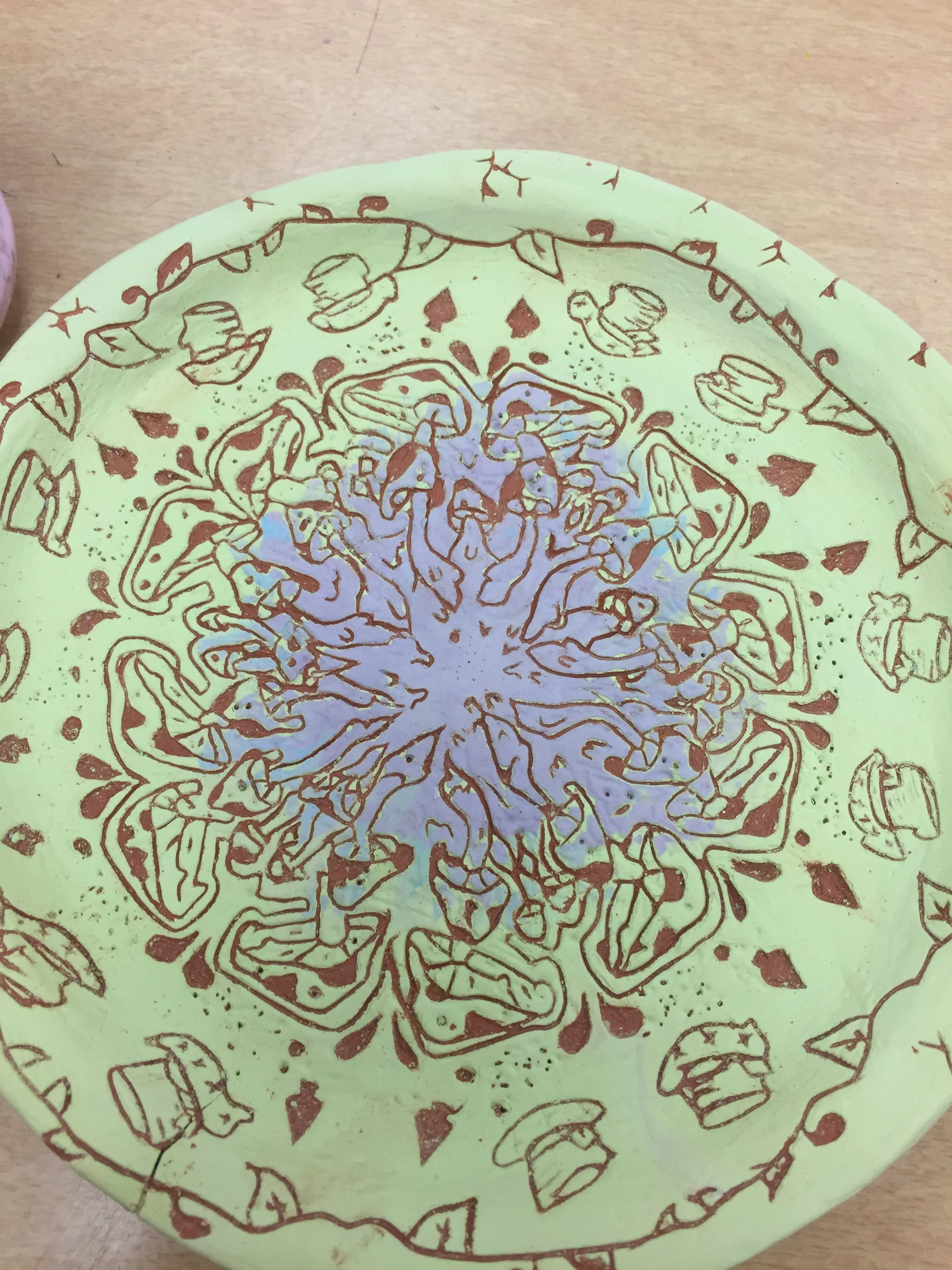 WE'RE ALL MAD HERE
2020
earthenware
repetitive image inspired by wonderland imagery, trippy vibes