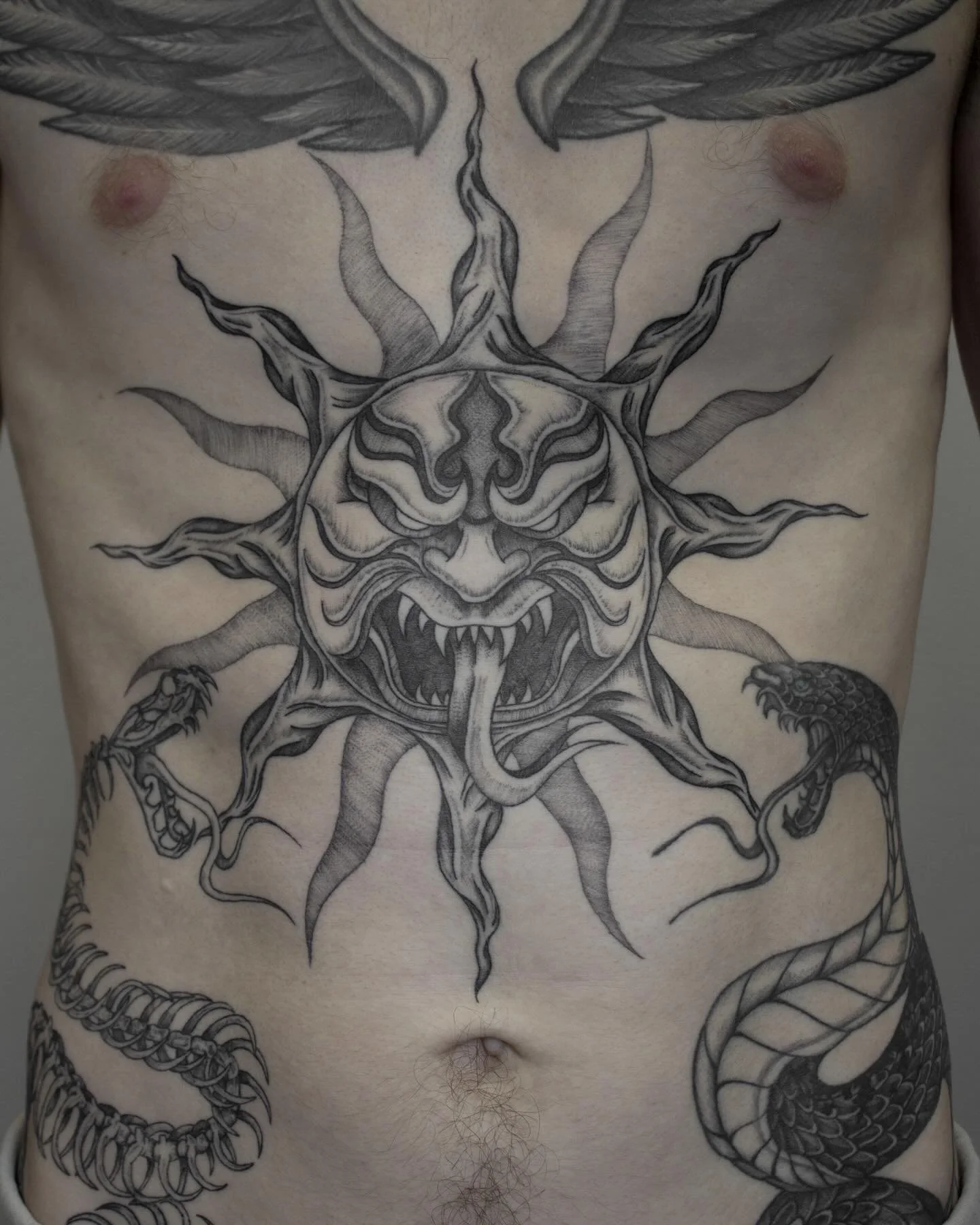 2 months healed #evil sun tattoo I did for Reinis . I&rsquo;ve done so many sun tattoos , but this was the first one that is made angry lookin and I love how it turned out 😈
*right snake is healed more than a year , left one is healed 4 months , win
