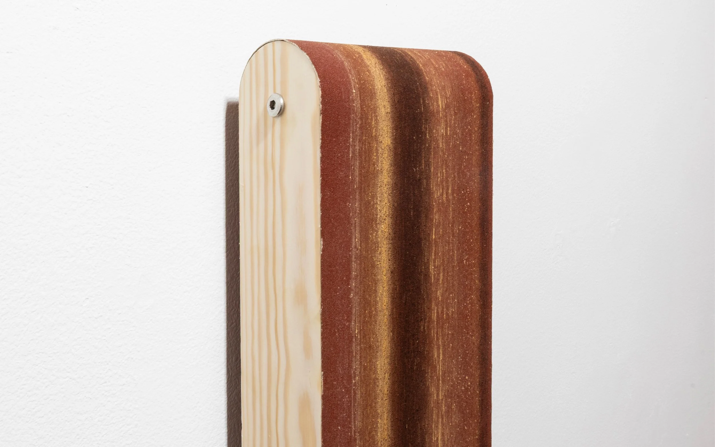 Lossy (100 Grit) 2025. Elm, cherry, coconut, tropical hardwood and rosewood on 100 grit sanding belt. Fixed with diluted wood glue and stretched on pine.