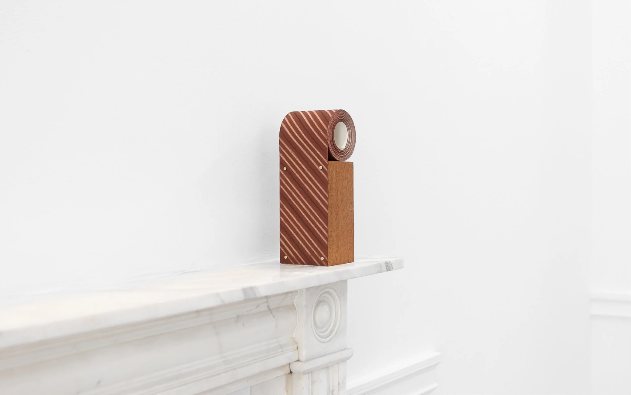 Mizzle (150 Grit) 2026
Sycamore, rosewood on 150 grit sandpaper roll, mounted on sapele with magnets 
