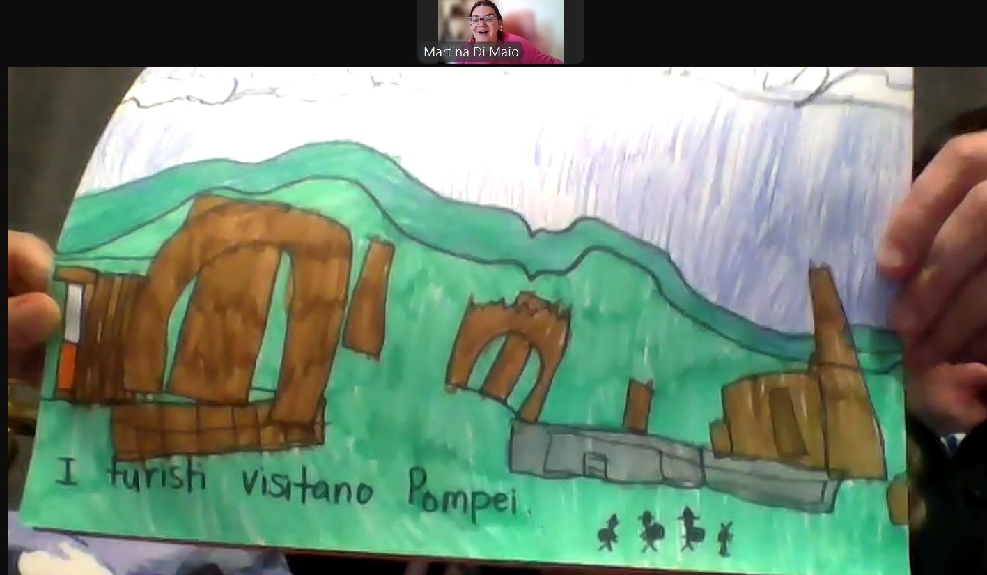 Hand-drawn picture of Mount Vesuvius erupting, with the city of Pompeii at the base, and a group of tourists depicted at the bottom, with the caption 'I visitando Pompeii'.