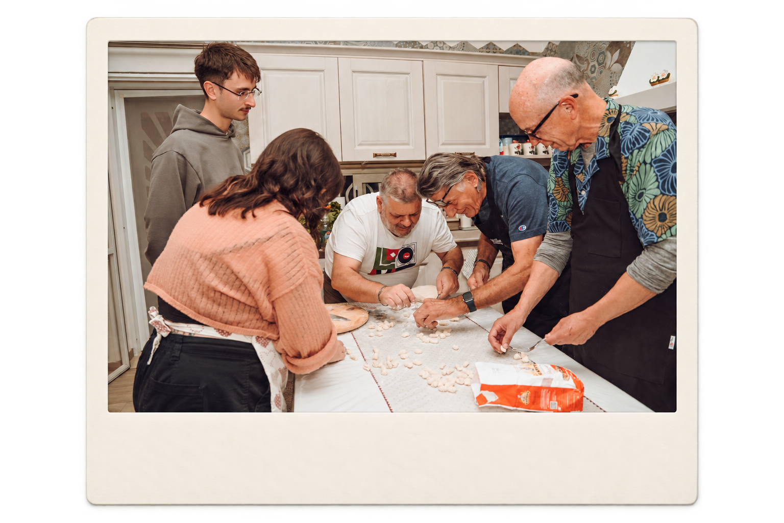 Students making fresh pasta during an Italian immersion programme