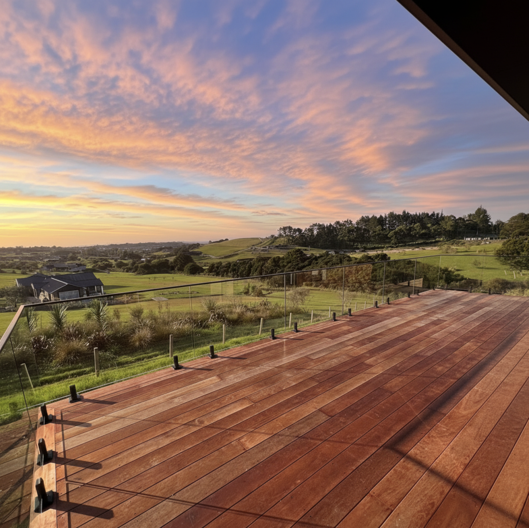 Toughened glass balustrade supported by spigots on exterior deck NZ