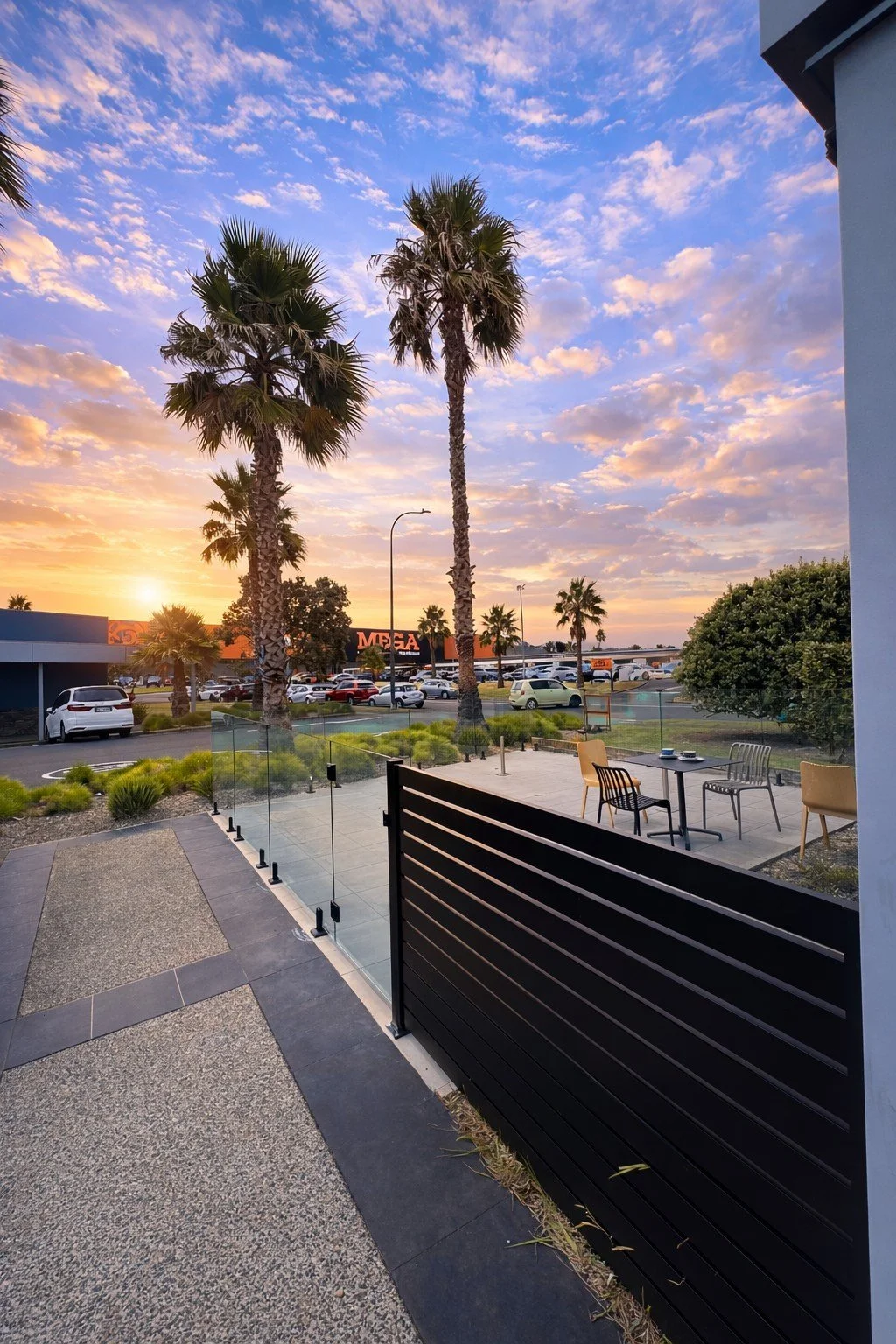 Black horizontal slat aluminium fence and gate, Auckland driveway