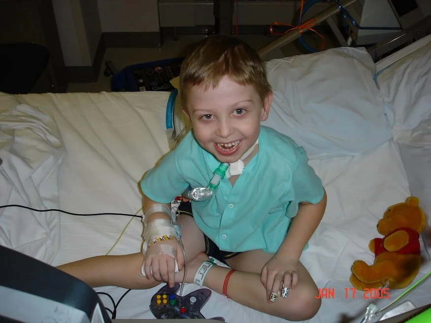 markus in bed with trach.jpg