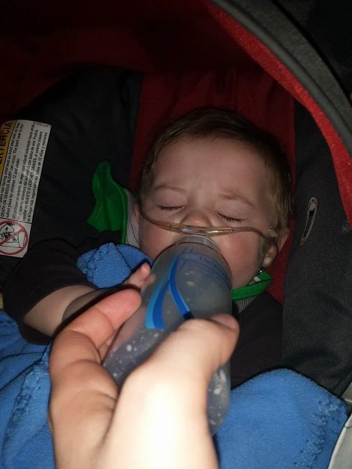 tanner in carseat.jpeg