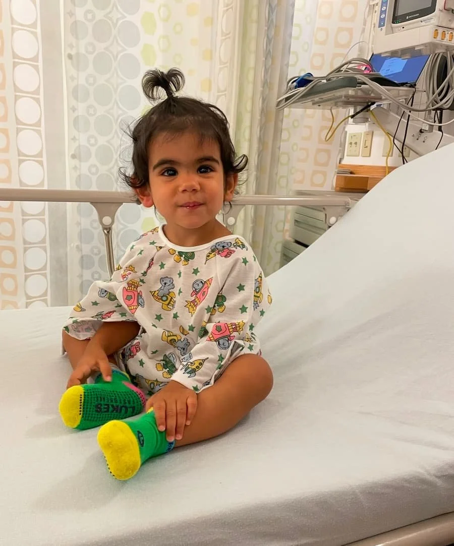 aubriana in hospital bed.jpeg