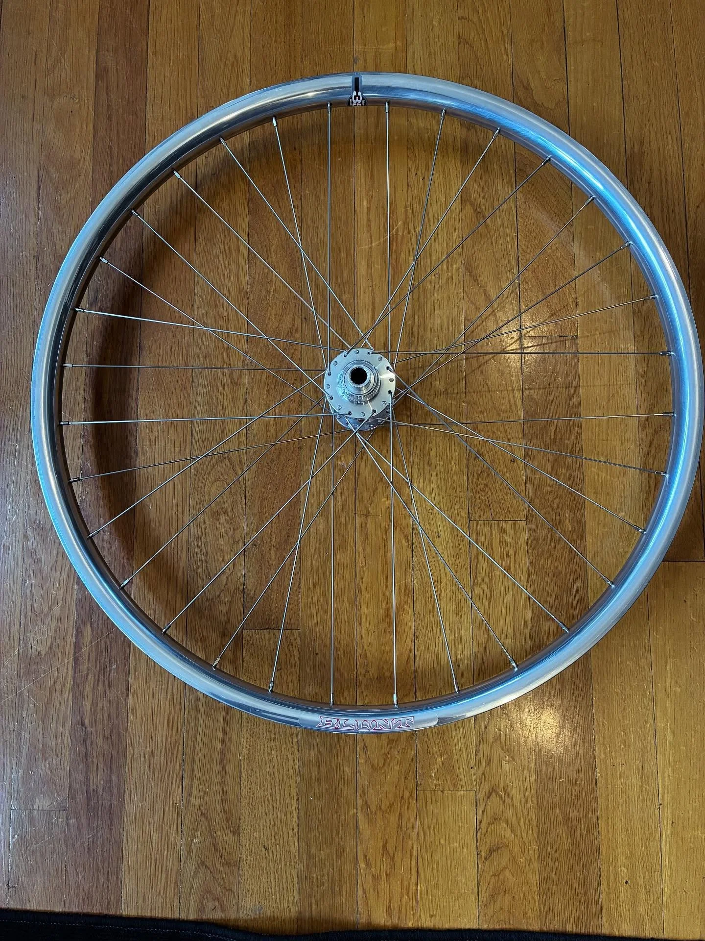 This front wheel is off to San Jose next week. Velocity Blunt 35 laced to a White Industry boost CLD hub. #vernbuiltwheels #handbuiltwheelsarebetter #handbuiltwheels #velocityblunt35 #whiteindustrieshubs #sapimracespokes #mirrorfinish #shiny #visitja