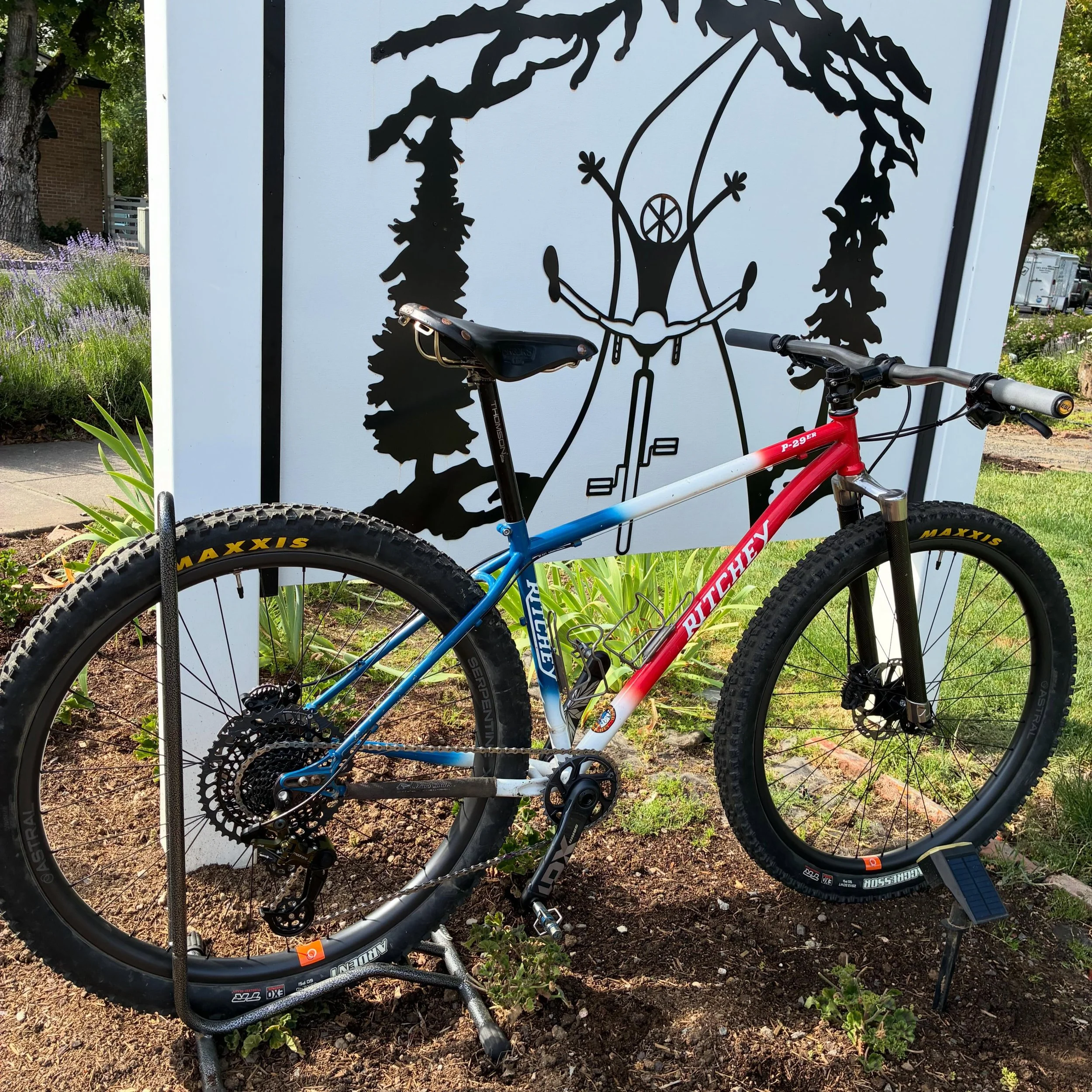 Giving new life to a classic MTB. Ritchey P29er newly outfitted with a modern 1x12 drivetrain train using SRAM shifter, crank and cassette. Topping it off with a Madrone Cycles Jab derailleur. New wheels are Astral Cycling Serpentine carbon wheels ut