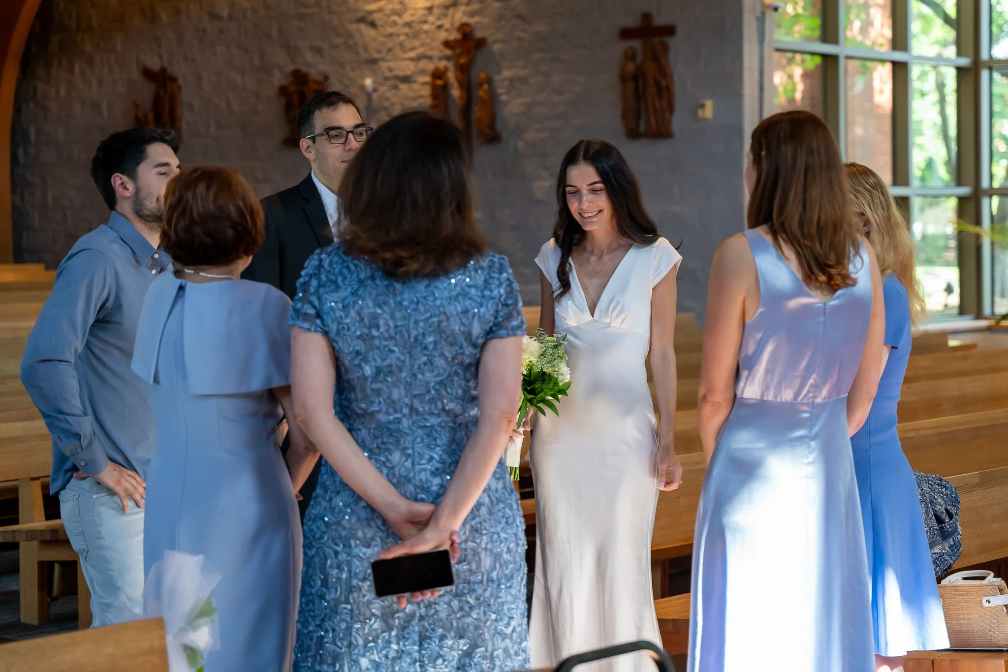 Group talking before Raleigh, NC wedding
