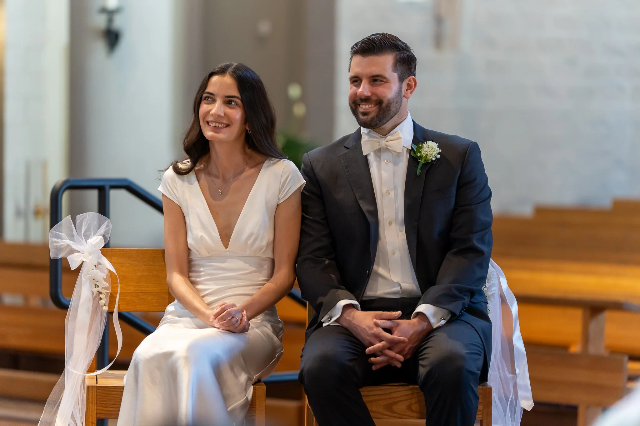Bride and groom listening to priest at Raleigh, NC wedding