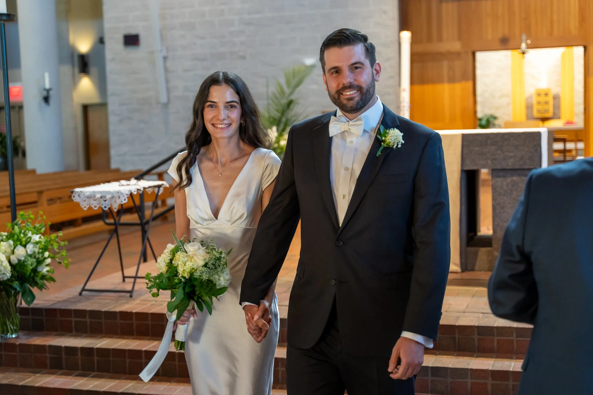 Bride and groom walking down the aisle at Raleigh, North Carolina wedding
