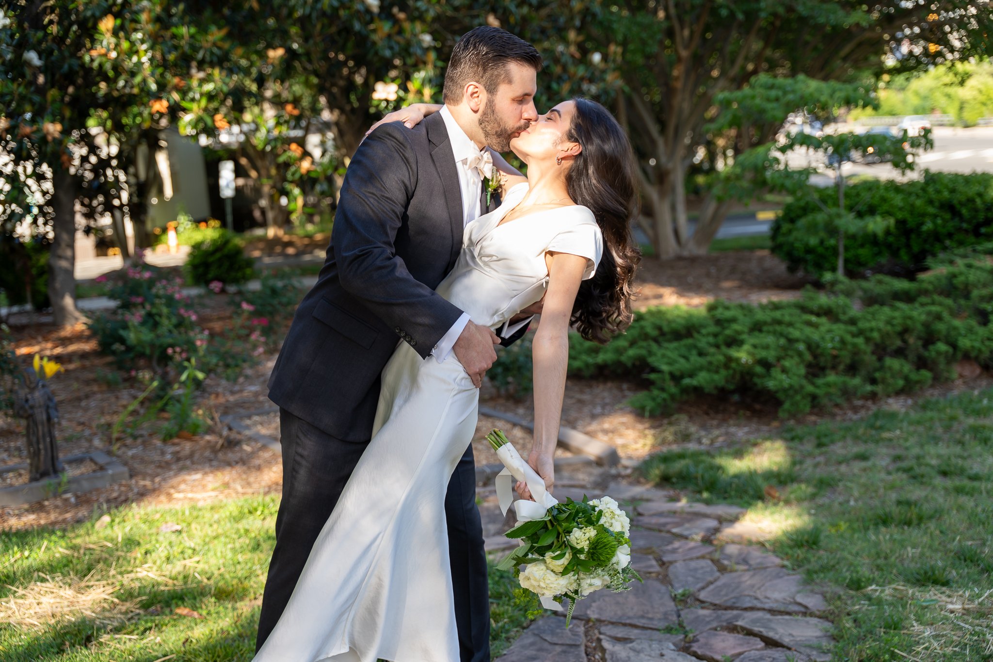 Bride and groom kiss at Raleigh, NC wedding