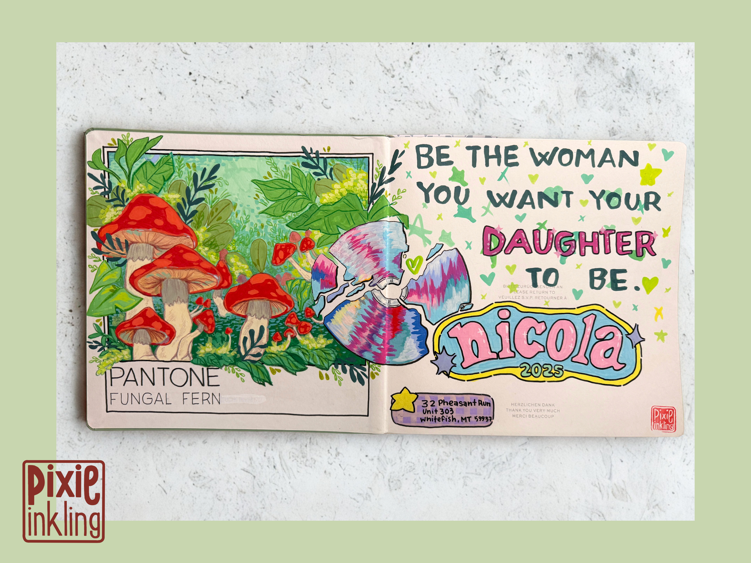 Colorful art journal page with illustrations of mushrooms, green foliage, and a rainbow flag. Handwritten messages include 'Be the woman you want your daughter to be,' and other notes about fungi and a thank you note. The page has vibrant colors and 