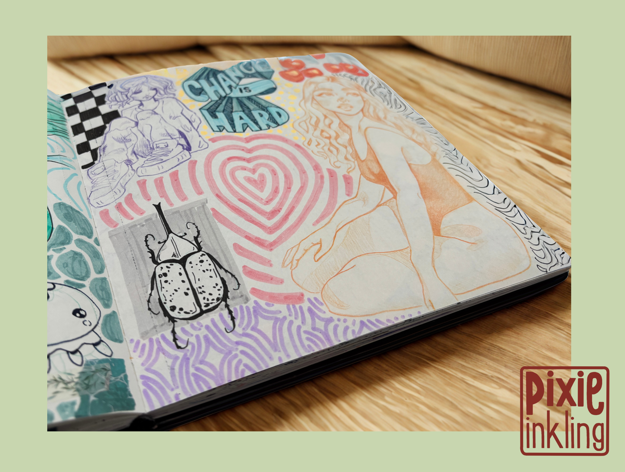 A sketchbook open on a wooden surface, featuring colorful drawings including a girl with wavy hair, a cartoon-like character, and a heart with spiral lines, with words like 'CHANGE IS HARD' incorporated in the designs.